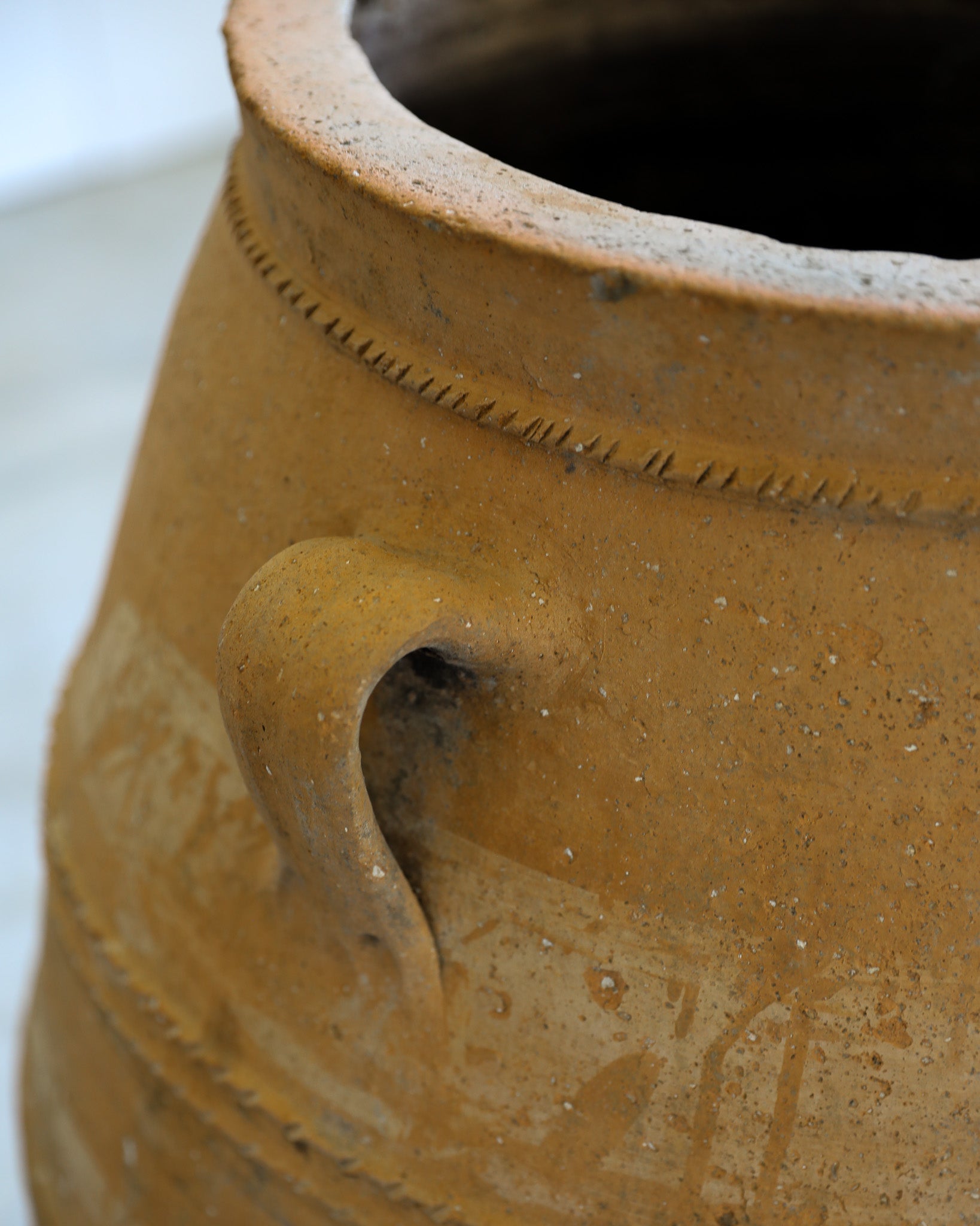 antique tapered turkish handled olive jar with etching details and natural patina closeup detail