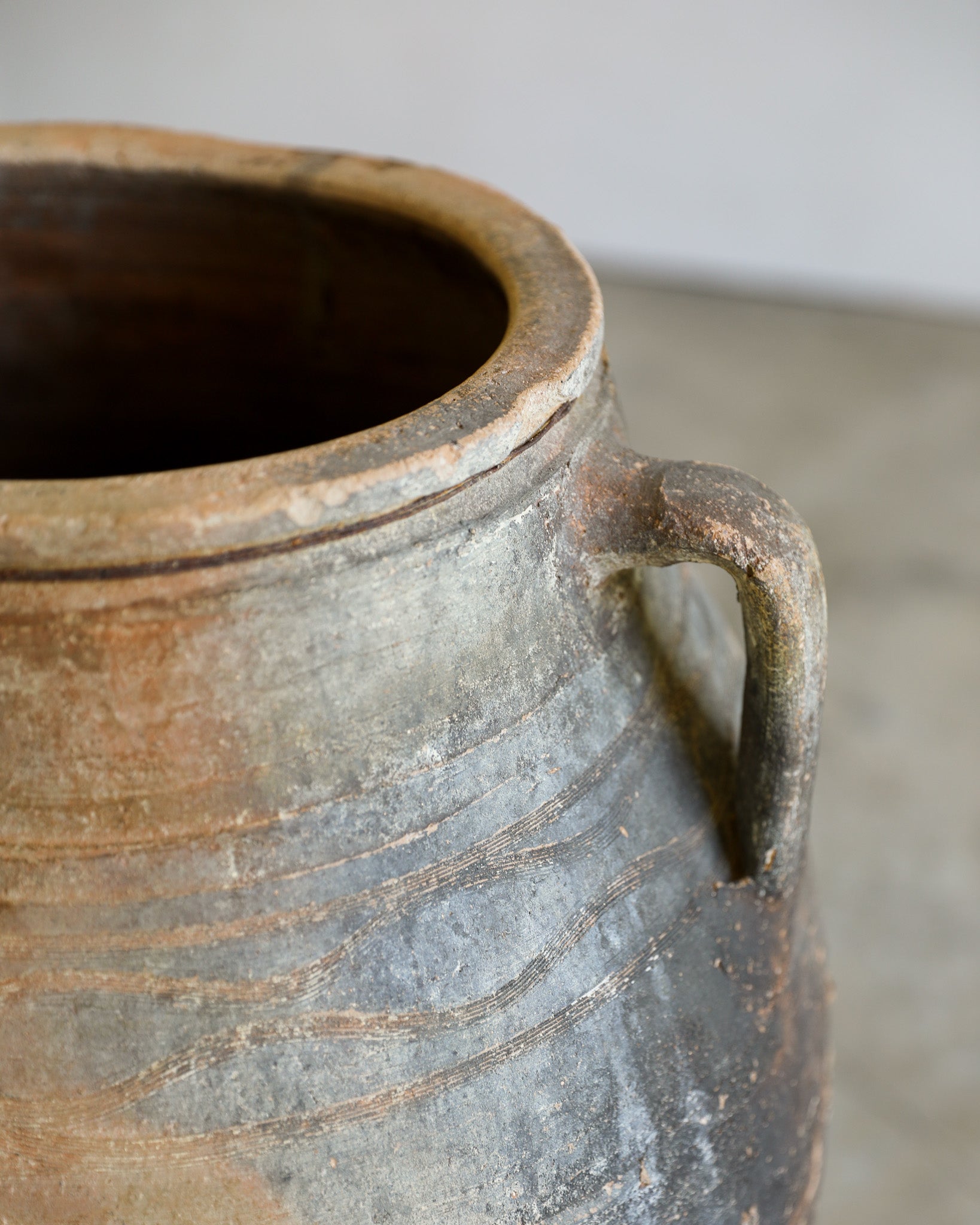 antique turkish handled olive jar with etching details and metal stand