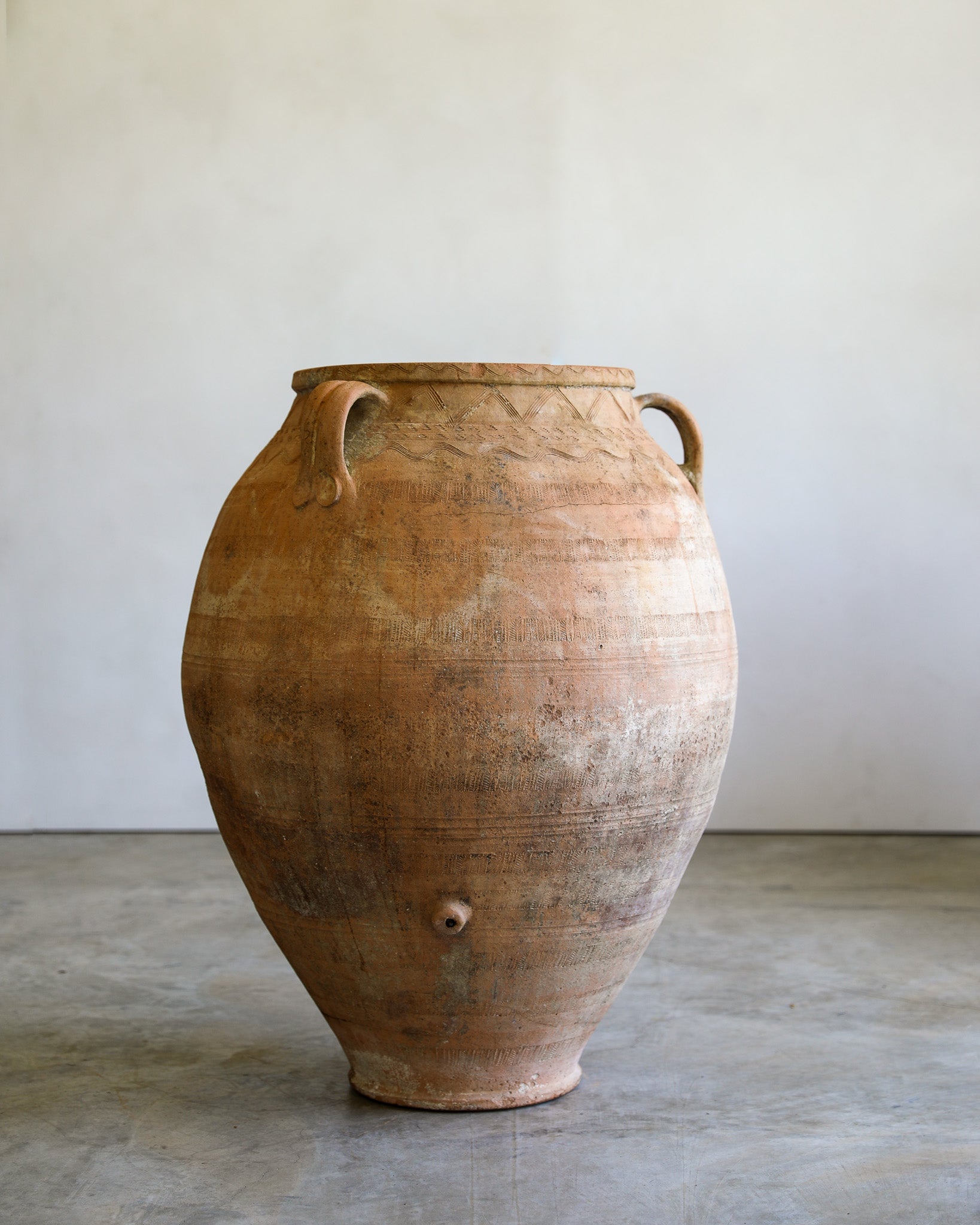 antique turkish handled olive jar with etching details and natural patina