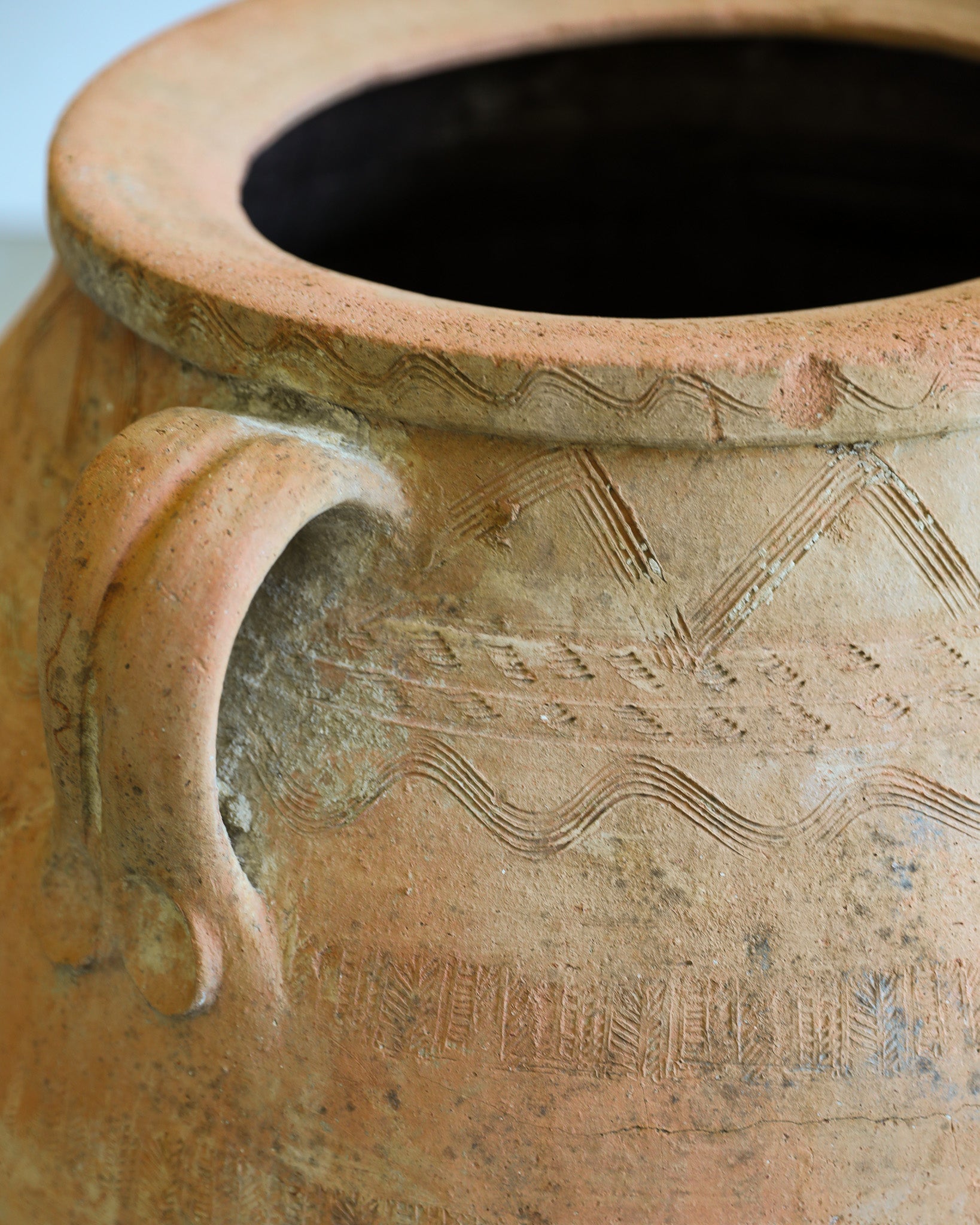 antique turkish handled olive jar with etching details and natural patina close up detail
