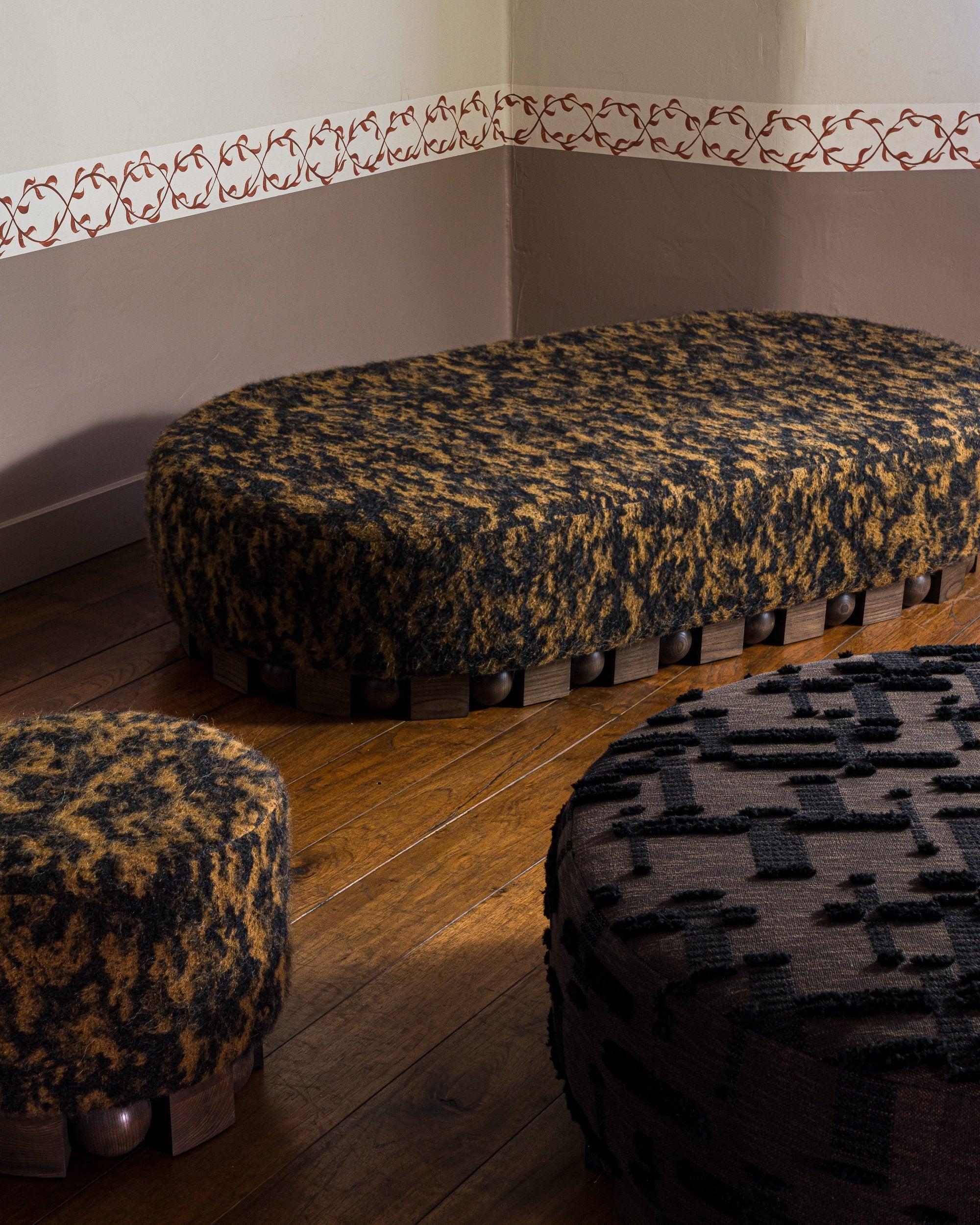 haus of hommeboys bishop collection pill shaped ottoman with detail of pouf and round ottoman