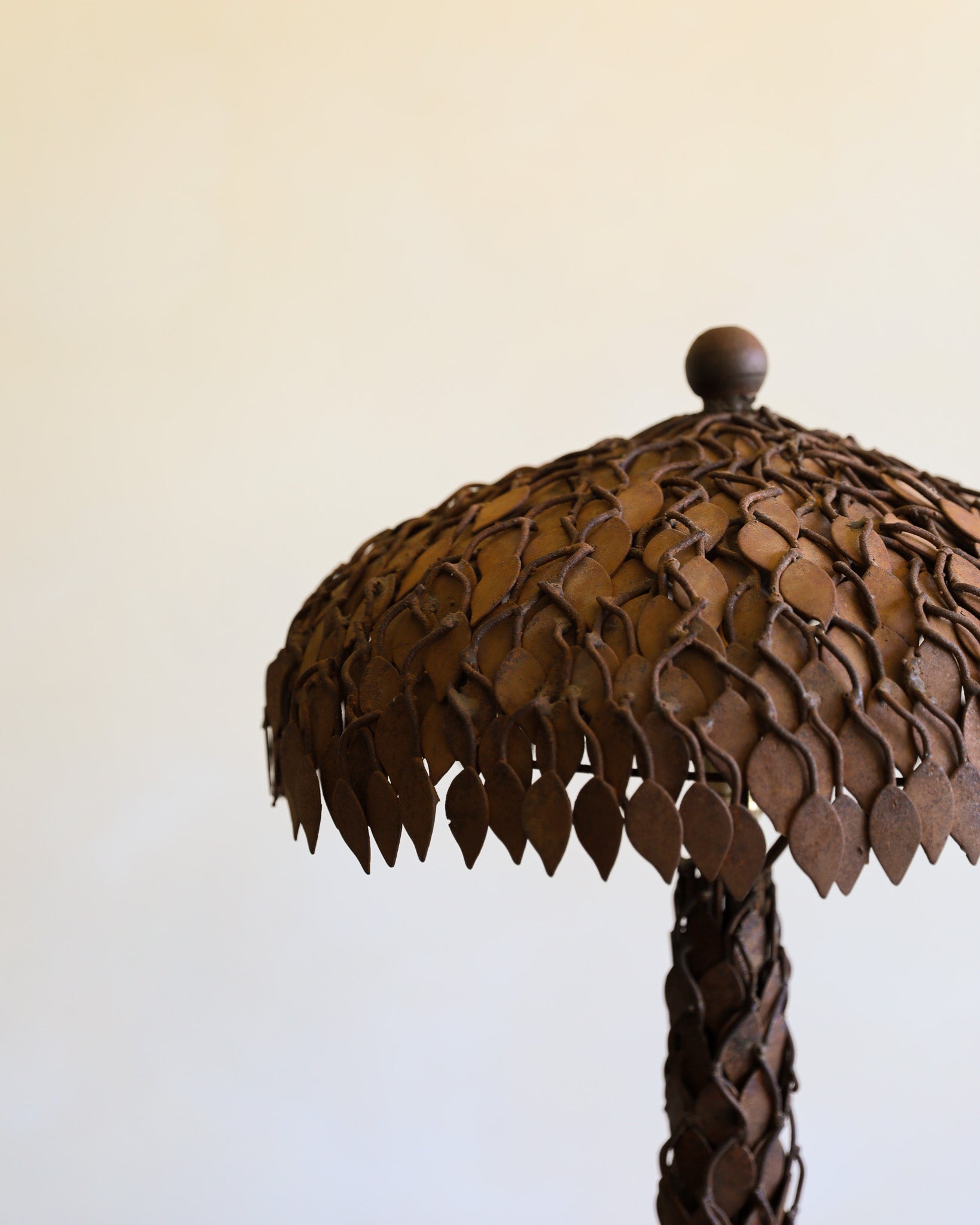 detail of metal table with leaf motif