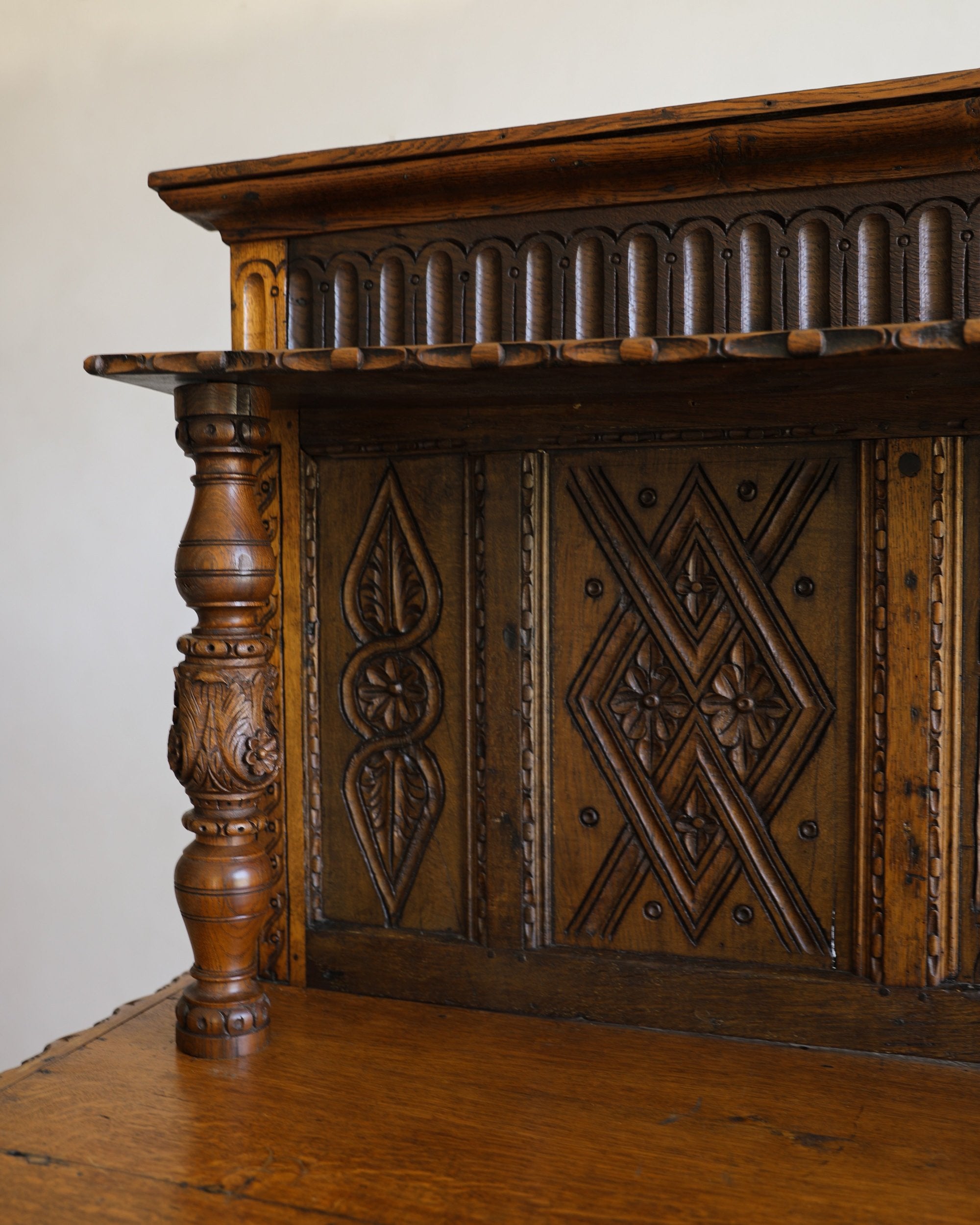 antique handcarved sideboard carved wood detailing shelf closeup