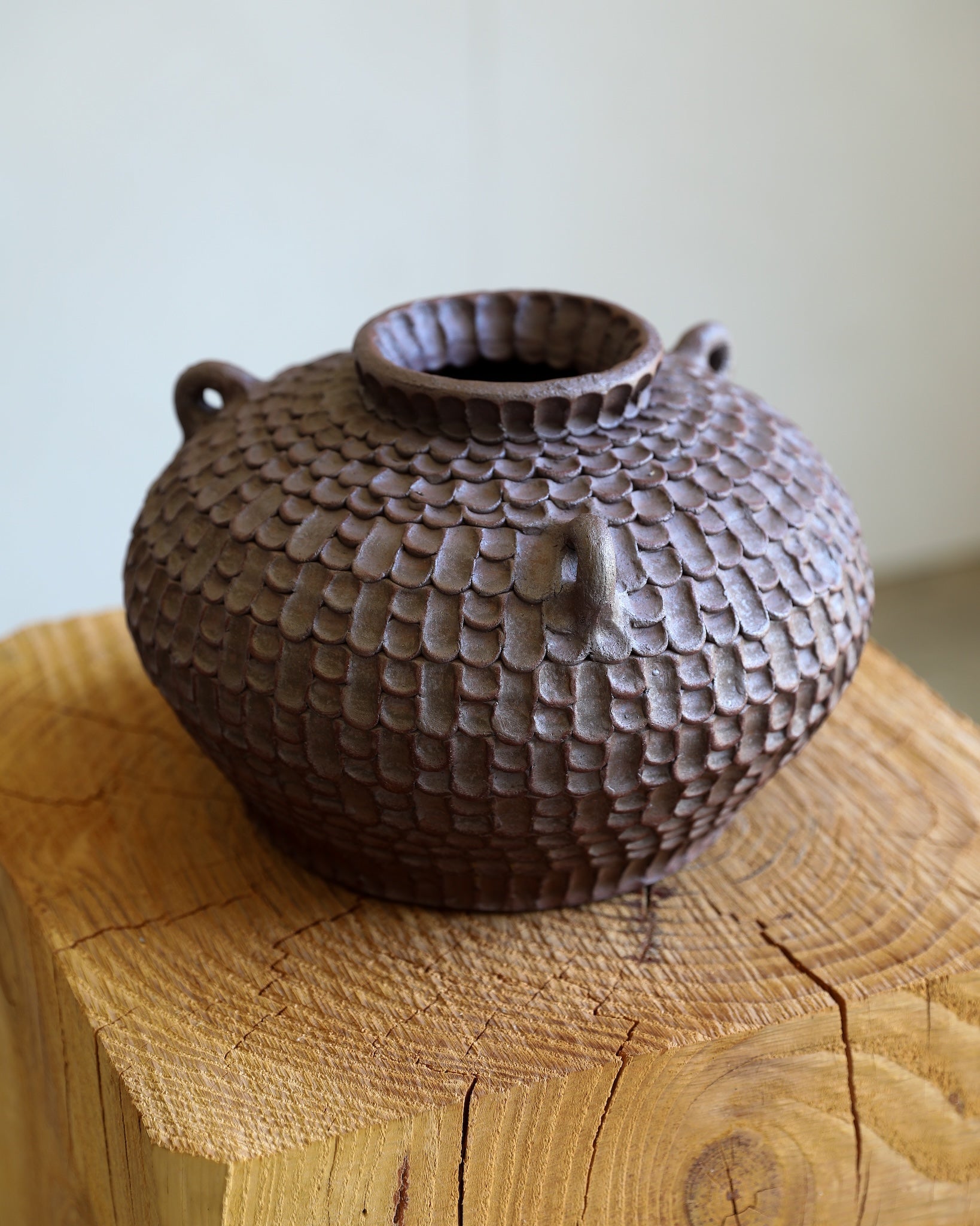 unglazed Fielding Clayworks handmade ceramic textured pot vessel open vase with handles with base