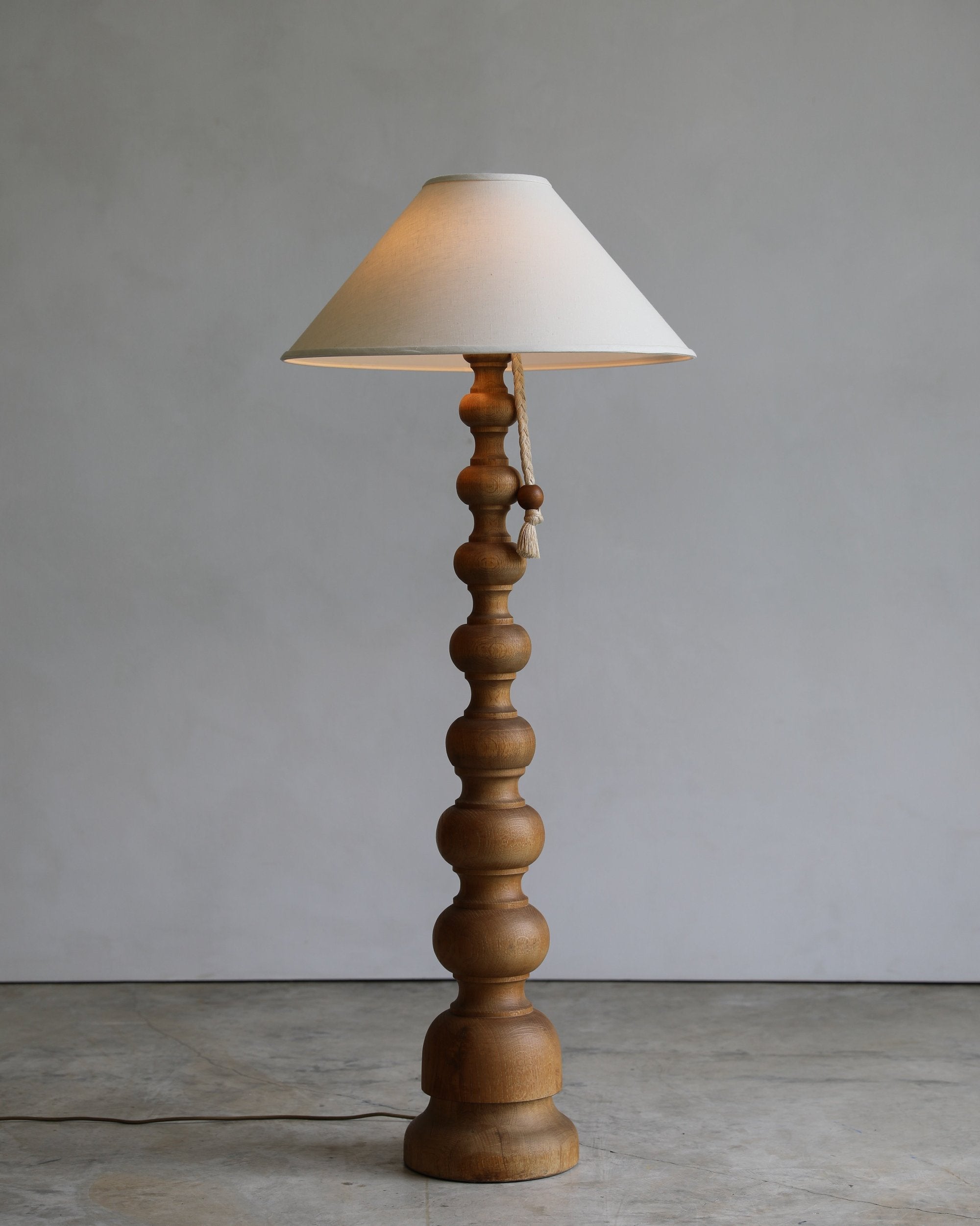 vintage turned wood floor lamp with rope pull detail and linen coolio shade on detail