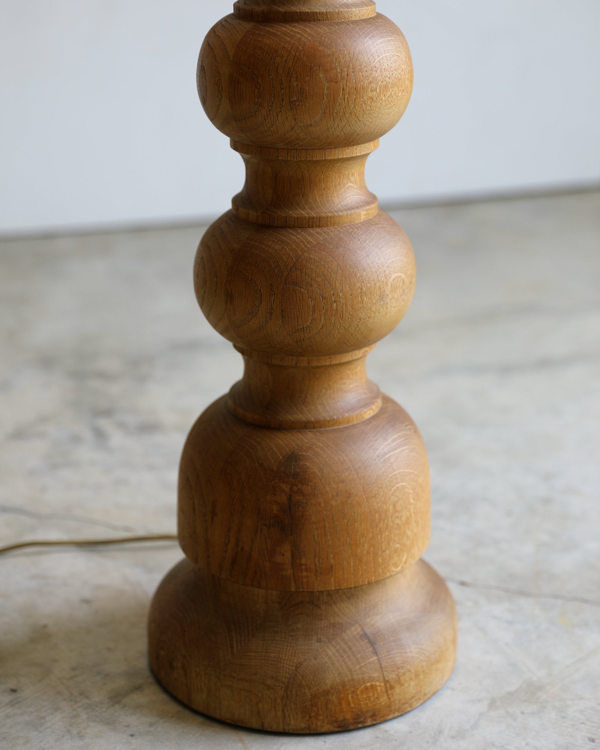 vintage turned wood floor lamp with rope pull detail and linen coolio shade base detail