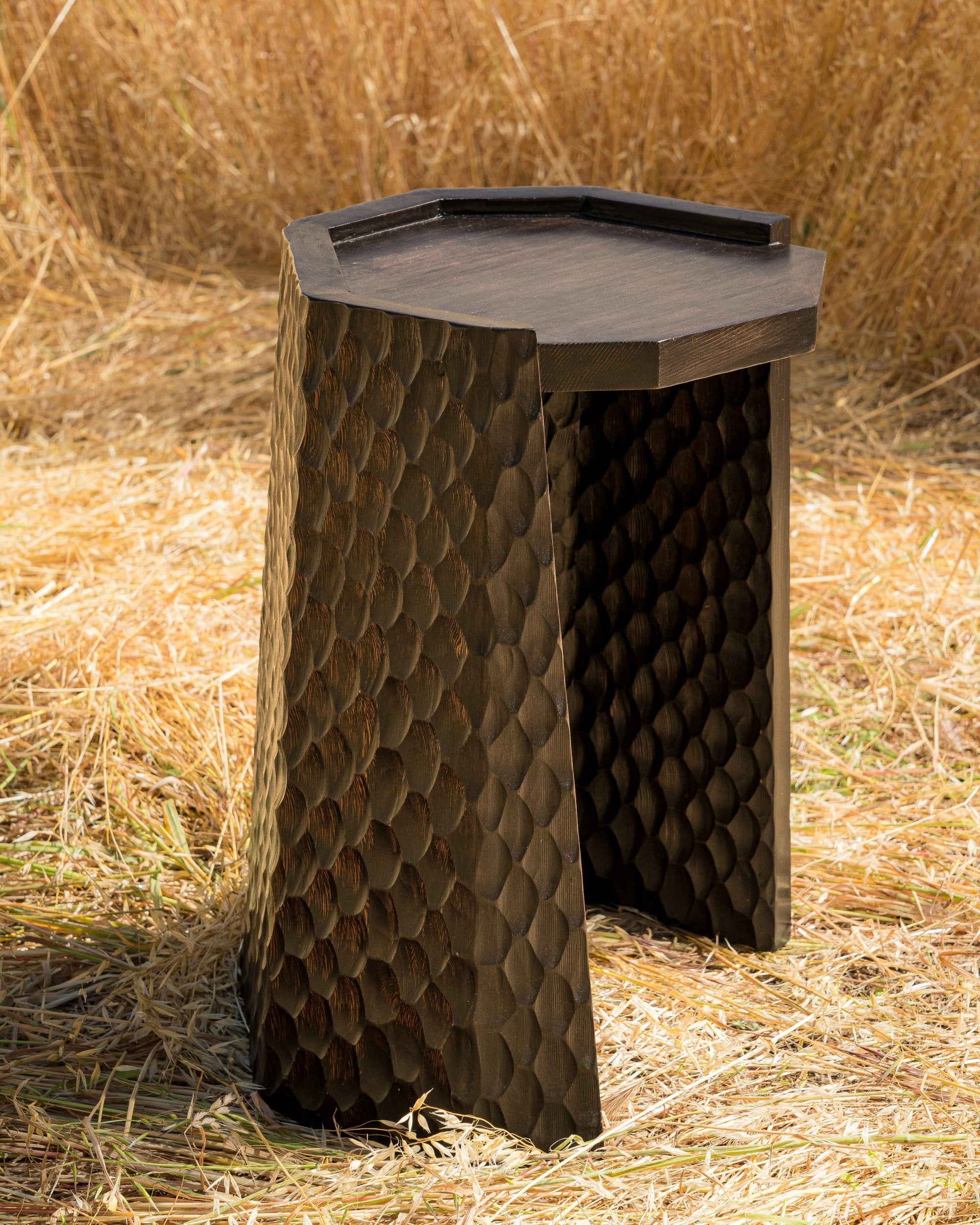 carved wood haus of hommeboys ocotillo side table in sonoma field