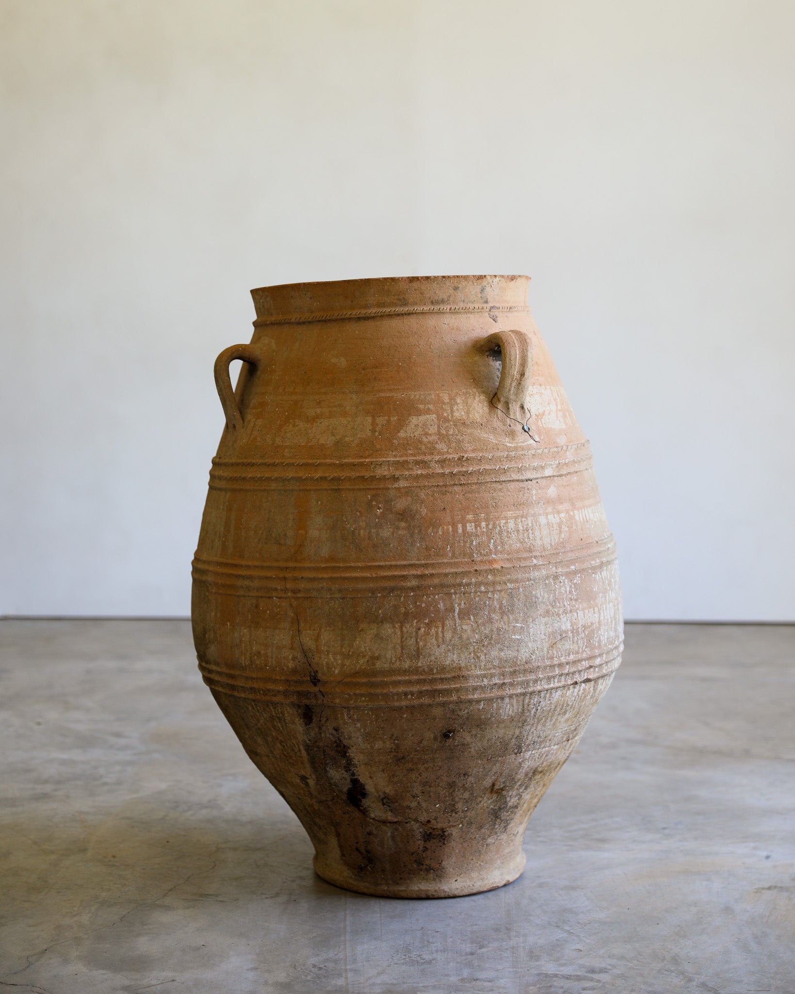 antique tapered turkish handled olive jar with etching details and natural patina