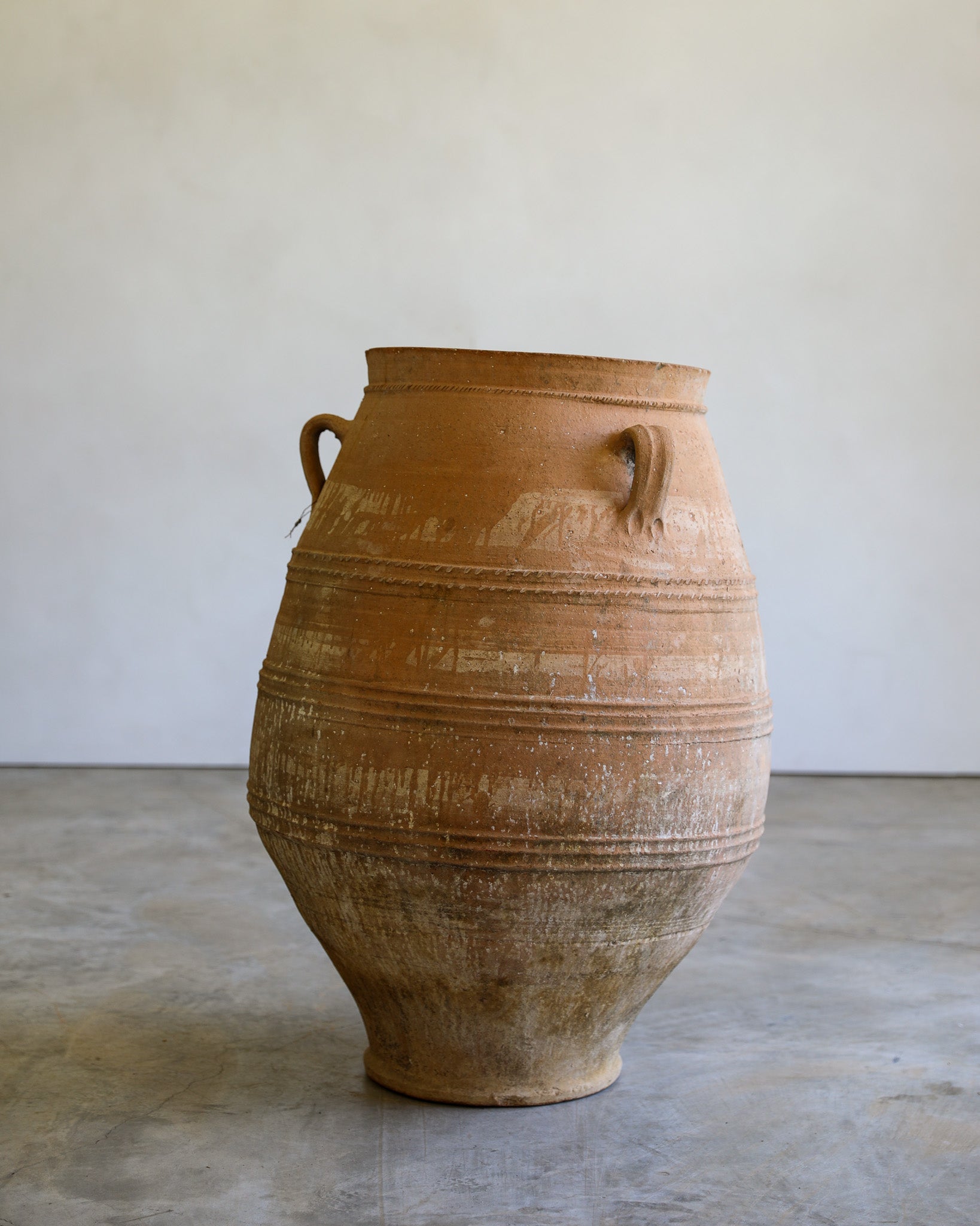 antique tapered turkish handled olive jar with etching details and natural patina