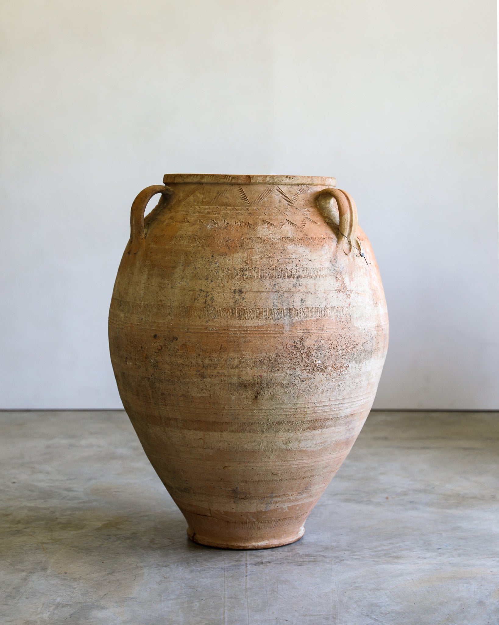 antique turkish handled olive jar with etching details and natural patina