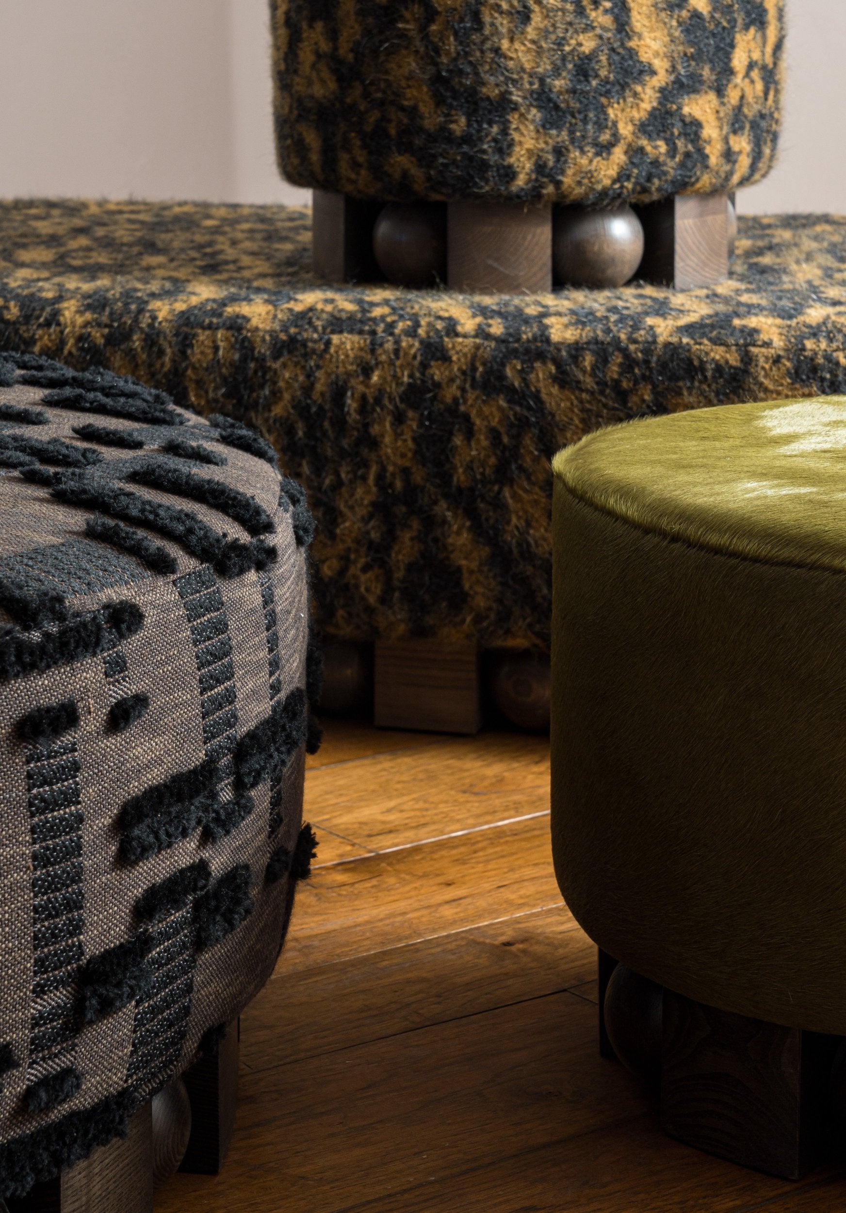 Close up detail of haus of hommeboys bishop collection poufs and ottomans