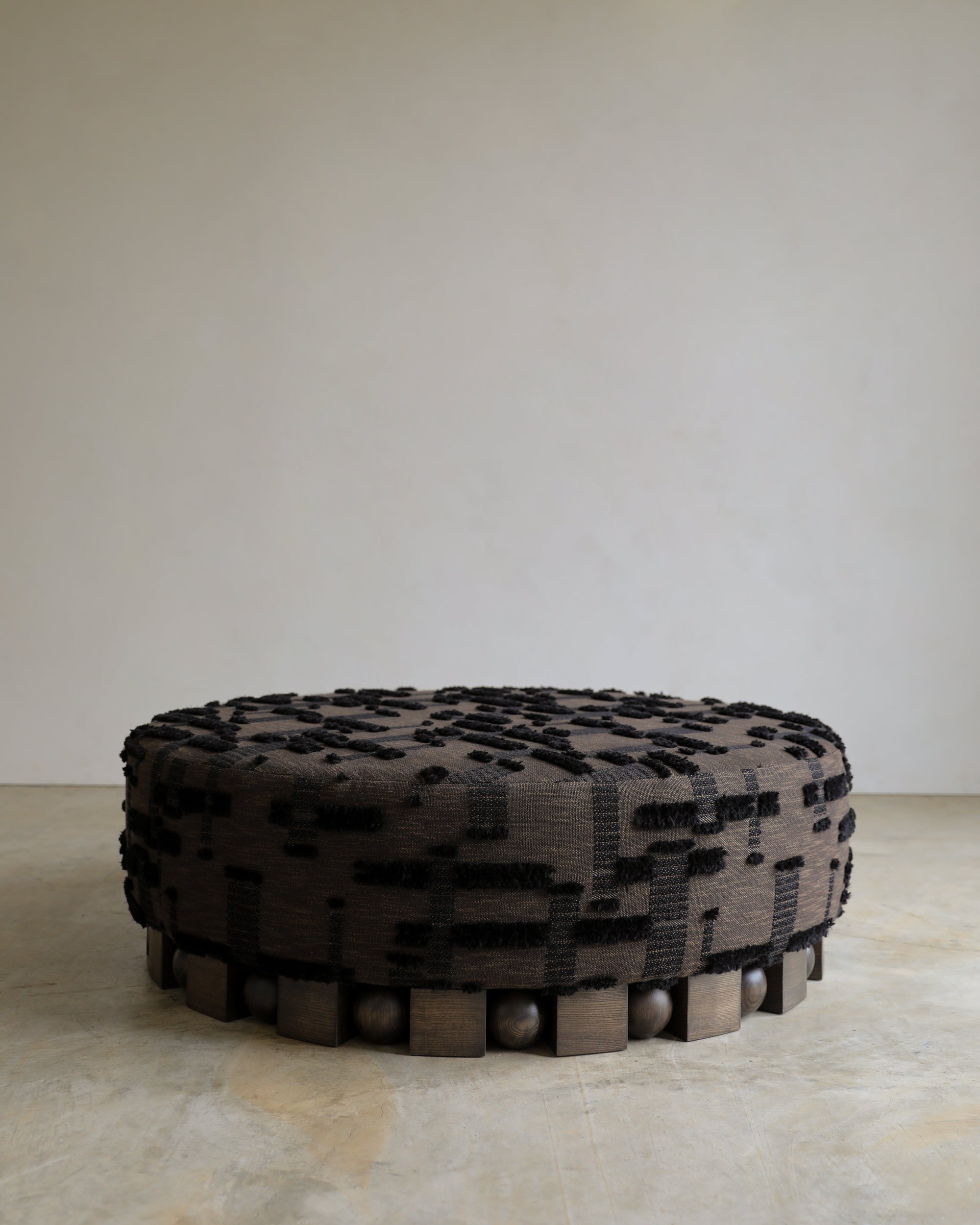 haus of hommeboys round bishop ottoman rubelli berber fabric