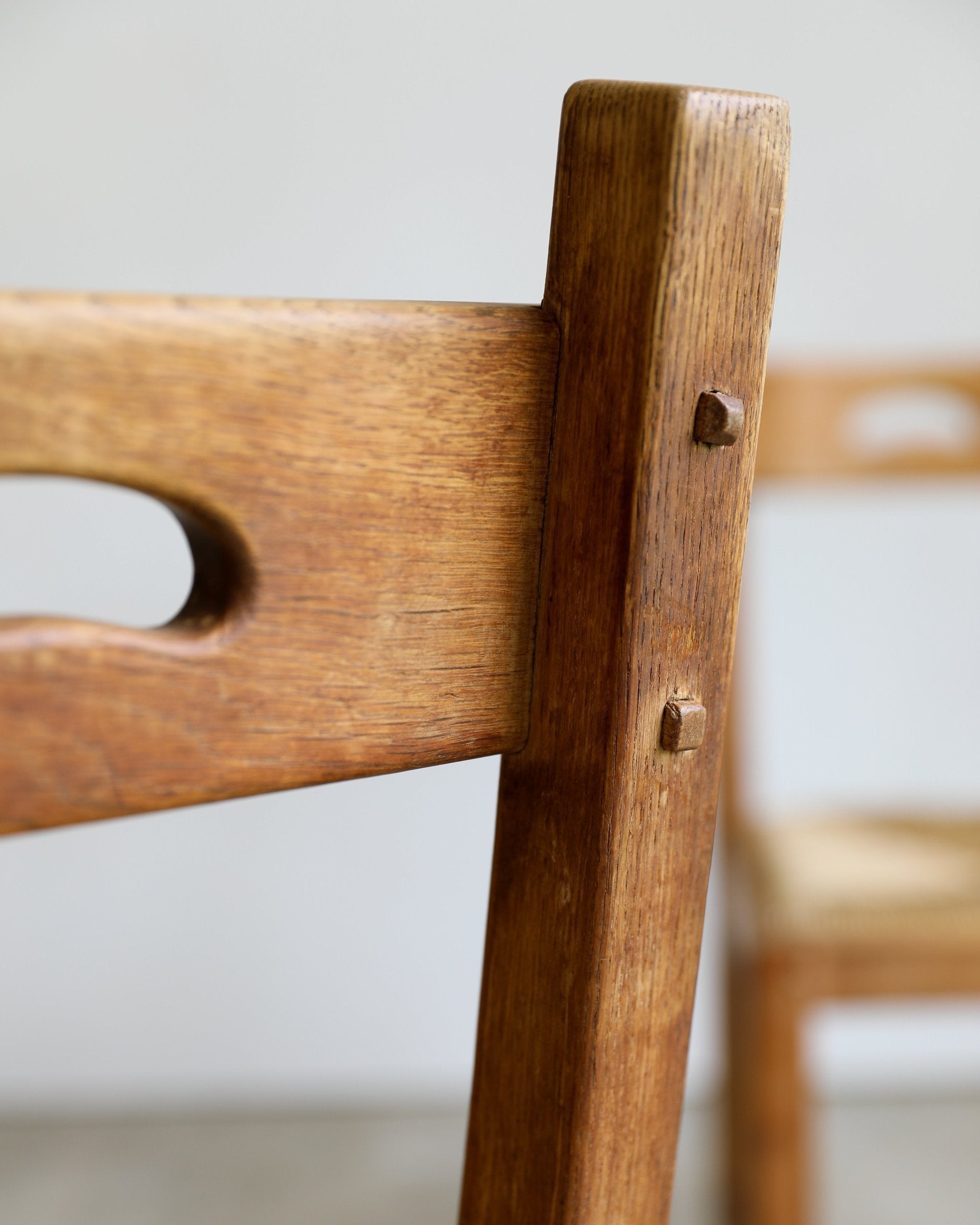 French Brutalist rush and wood vintage dining chair closeup detail back of chair