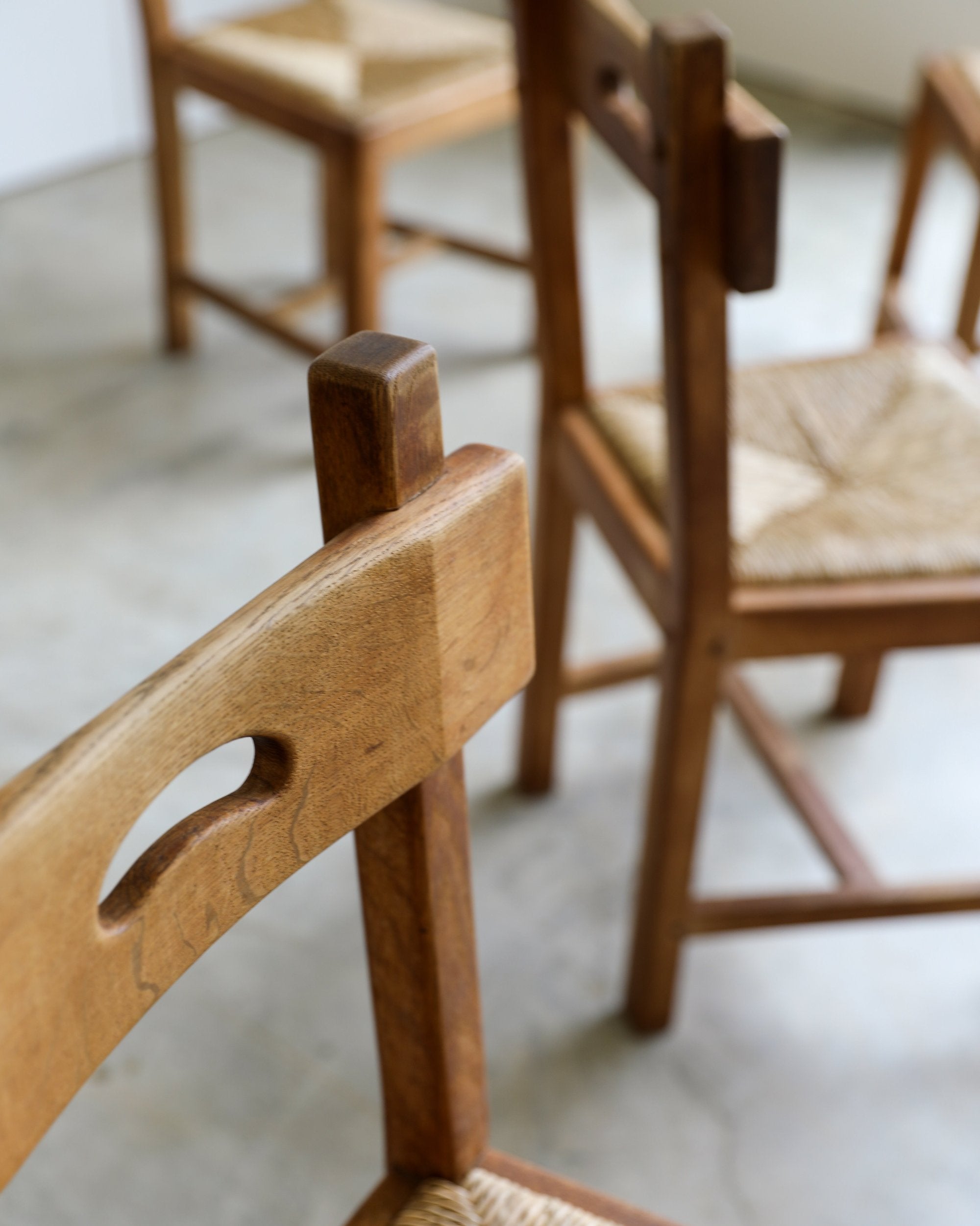 French Brutalist rush and wood vintage dining chair top detail