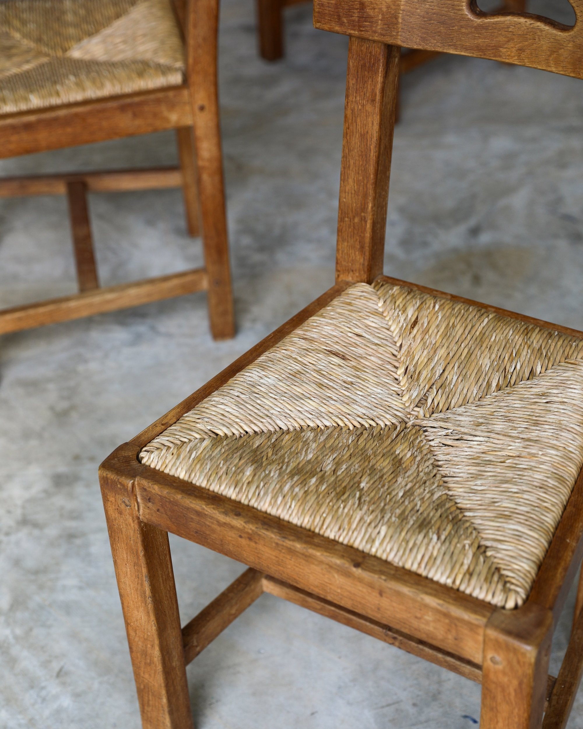 French Brutalist rush and wood vintage dining chair seat detail