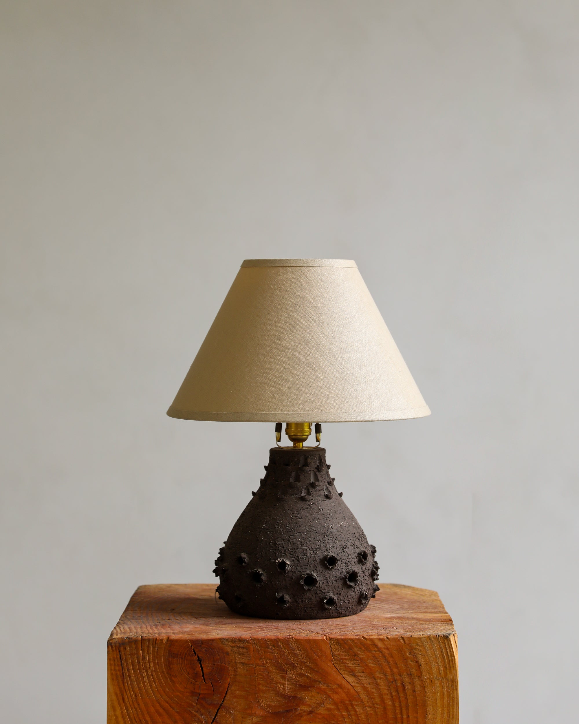 vintage brutalist ceramic table lamp with linen shade