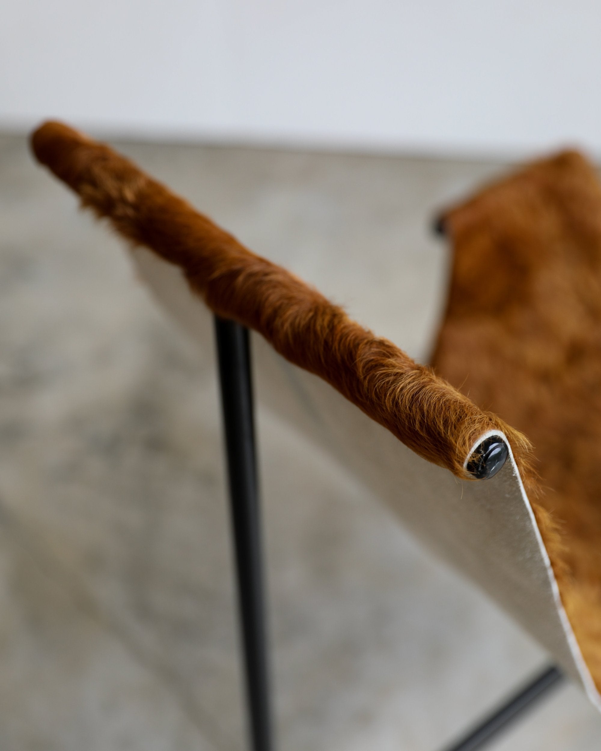 vintage cowhide brown t sling chair metal frame lounge chair top of chair detail