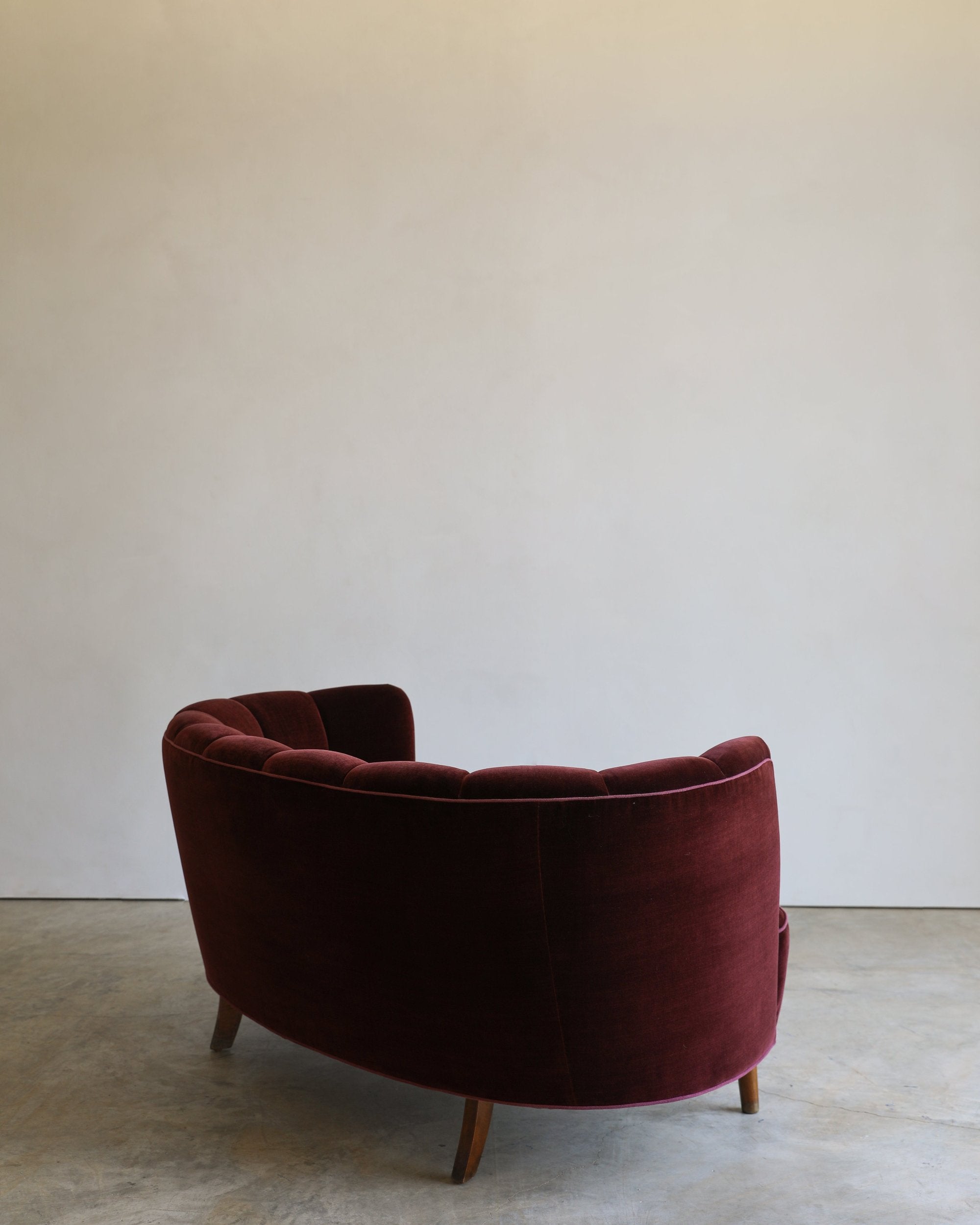 vintage reupholstered velvet channel tufted settee sofa with wooden feet back detail