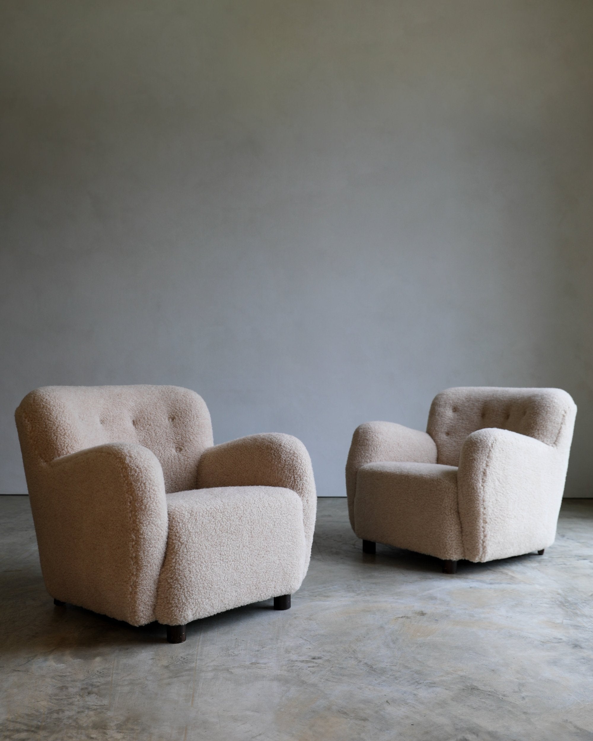 vintage sheepskin curvy danish lounge chair pair three quarter view