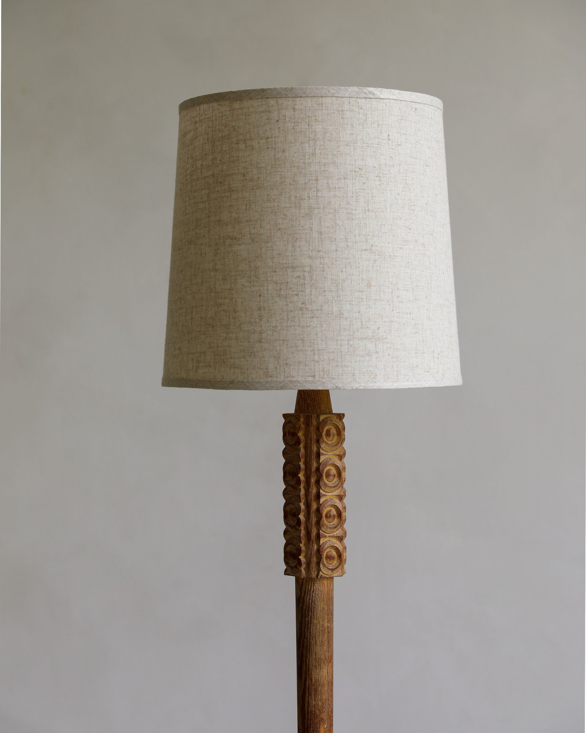 vintage carved wood and patina brass floor lamp with linen shade detail