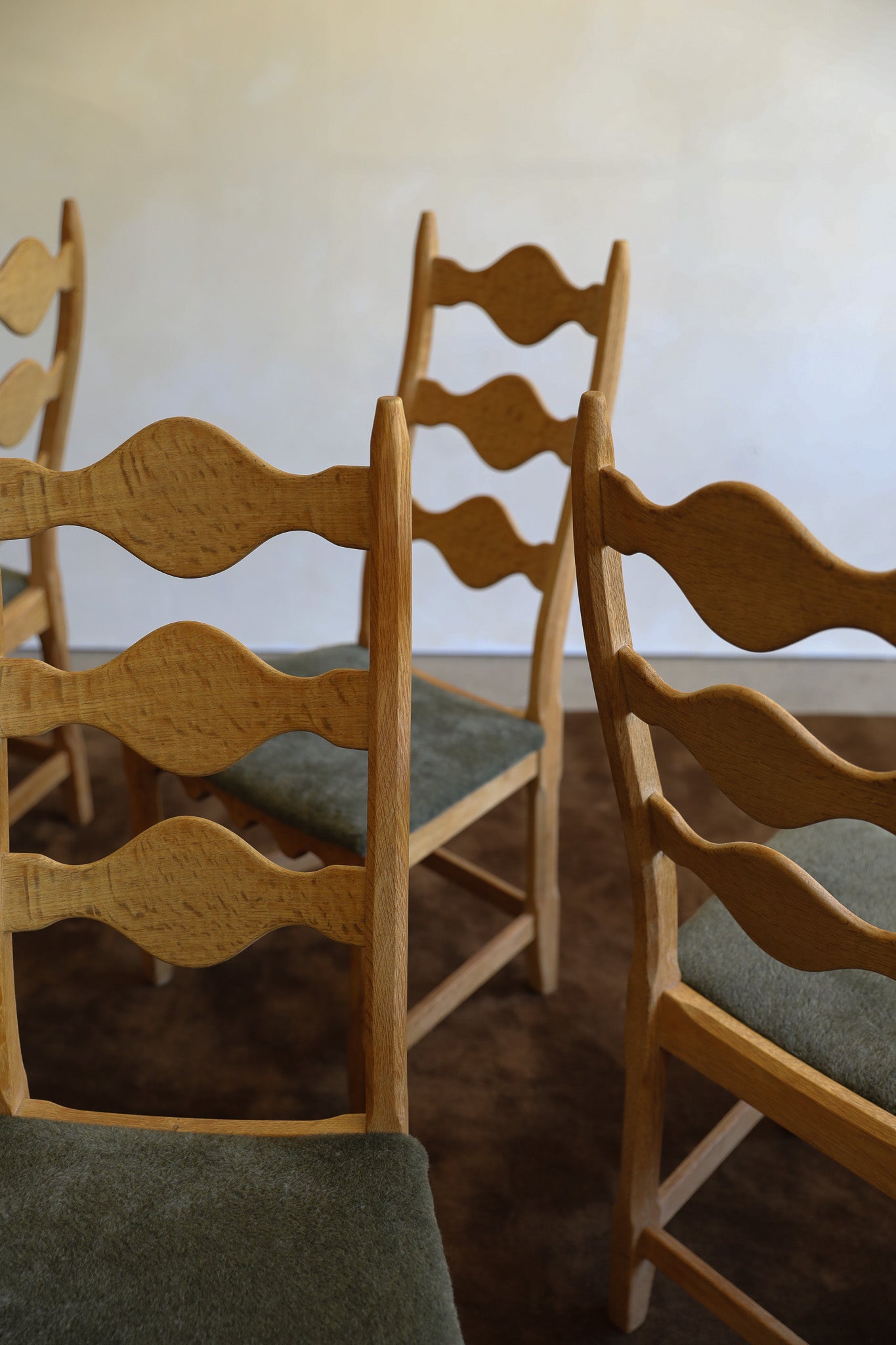 Henning Kjærnulf Razor Back Dining Chair detail on brown wool rug