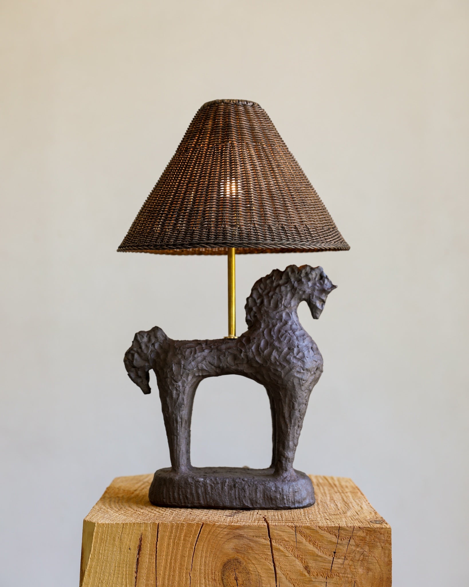 unglazed Fielding Clayworks handmade ceramic horse lamp custom wicker lampshade raw brass fittings table lamp on