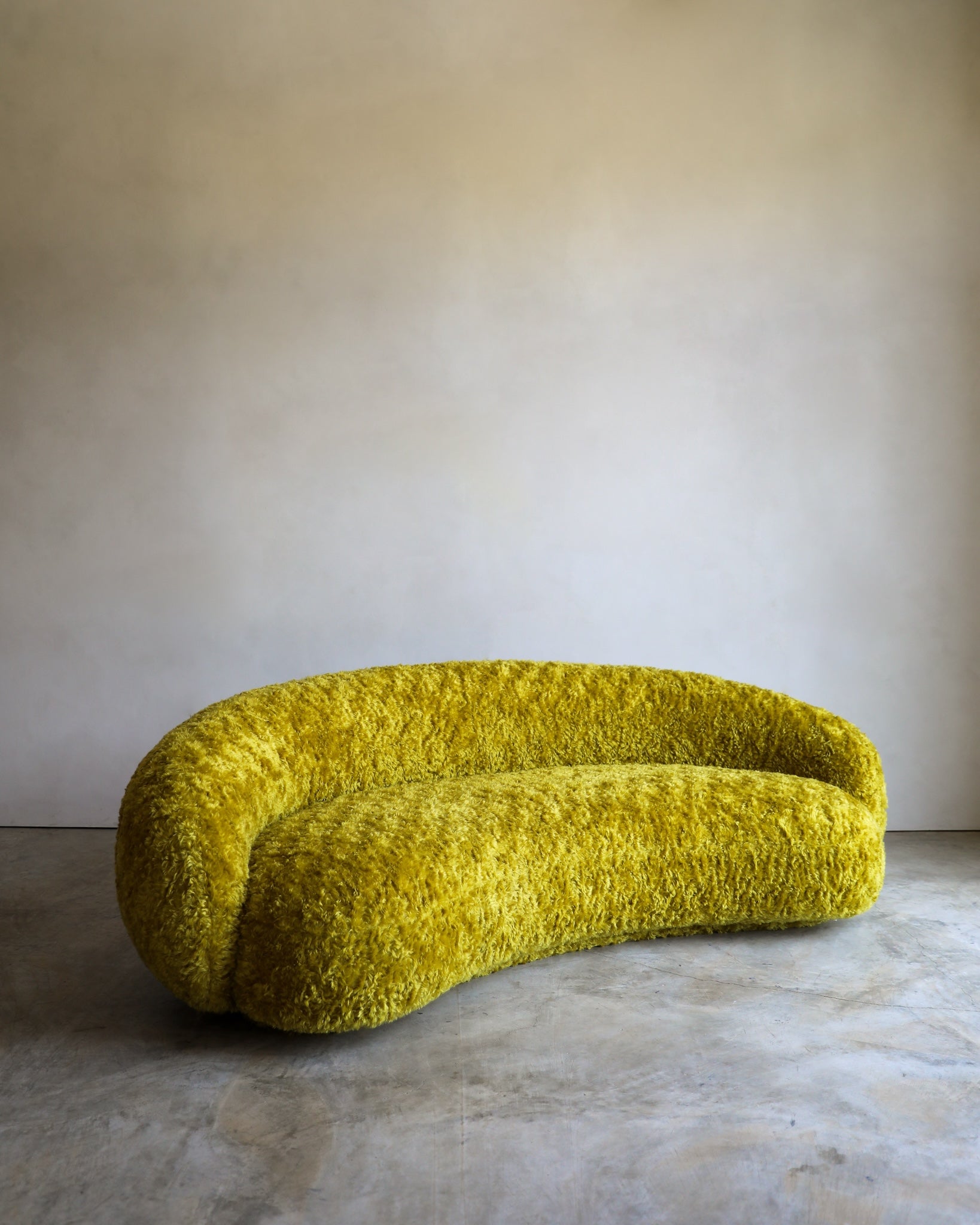 vintage Julep Sofa from Taccini recovered in a brilliant, rich yellow Argo wool mohair from Raf Simmons three quarter view