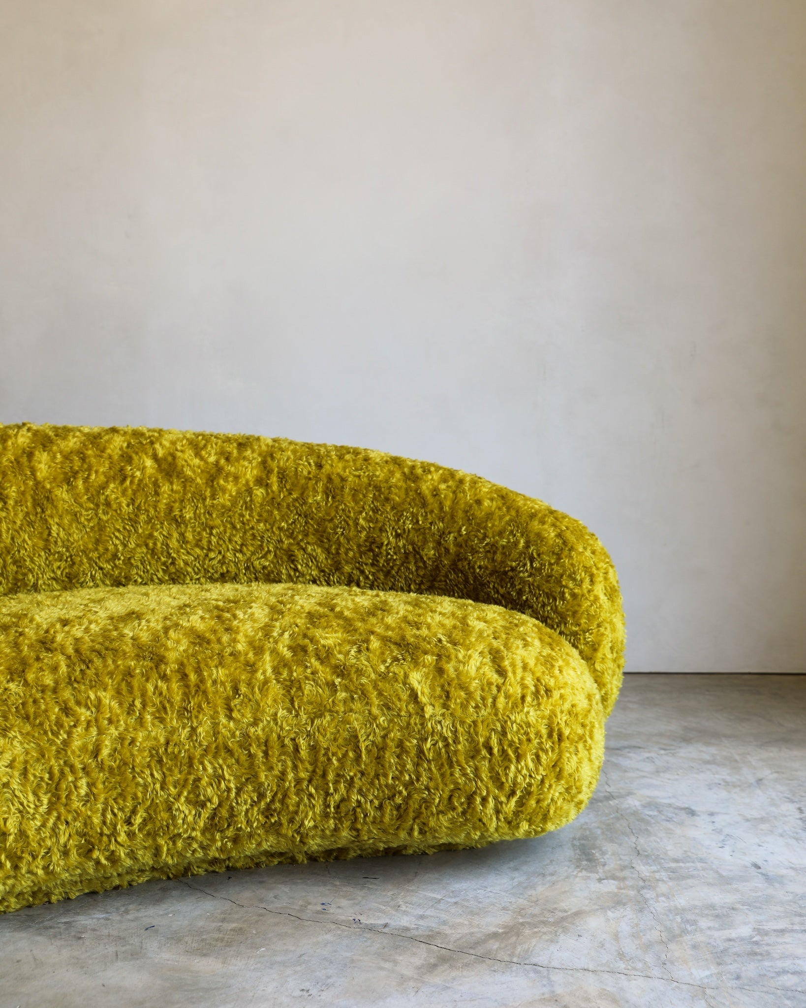 vintage Julep Sofa from Taccini recovered in a brilliant, rich yellow Argo wool mohair from Raf Simmons