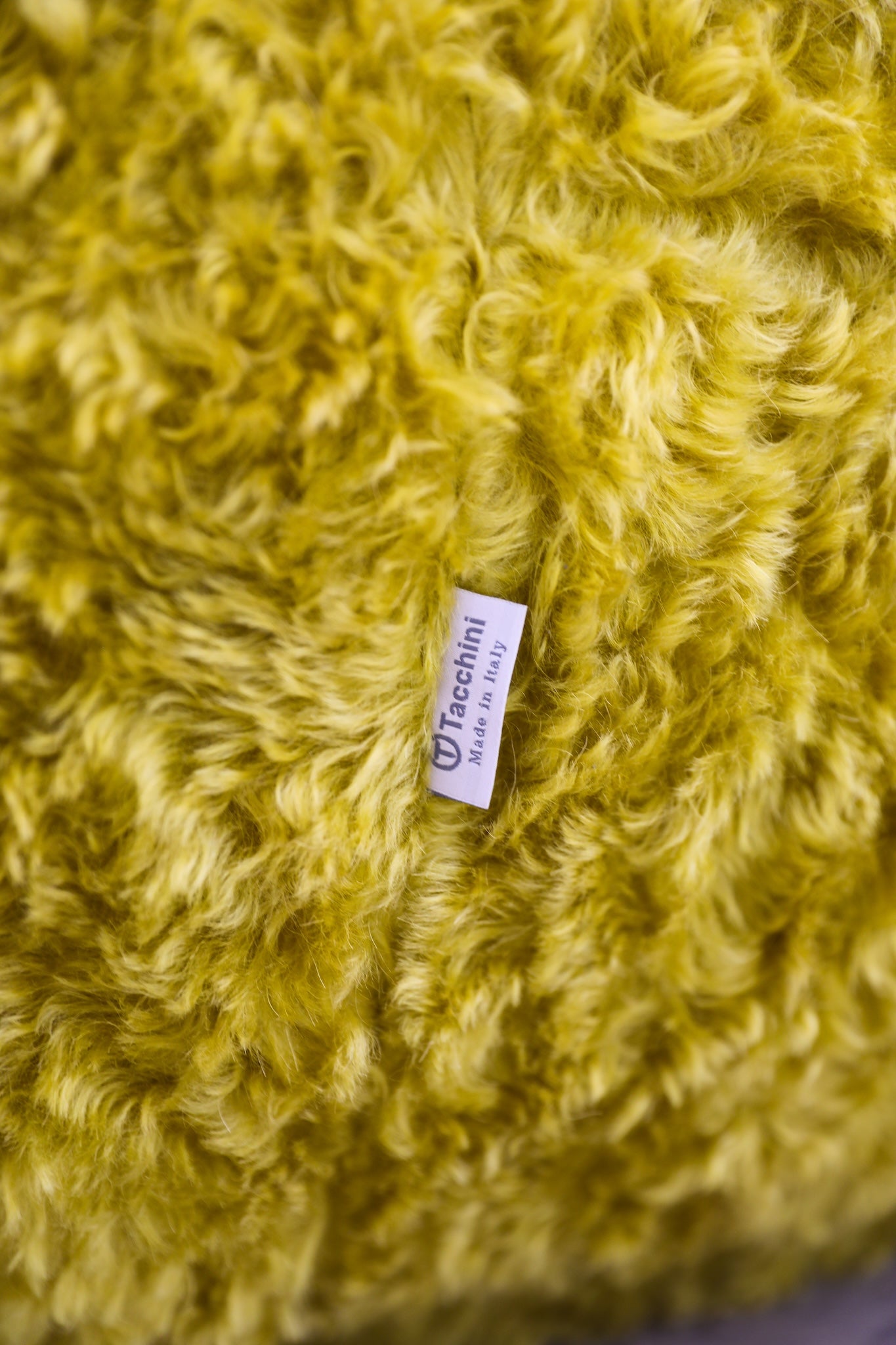 vintage Julep Sofa from Taccini recovered in a brilliant, rich yellow Argo wool mohair from Raf Simmons tag detail