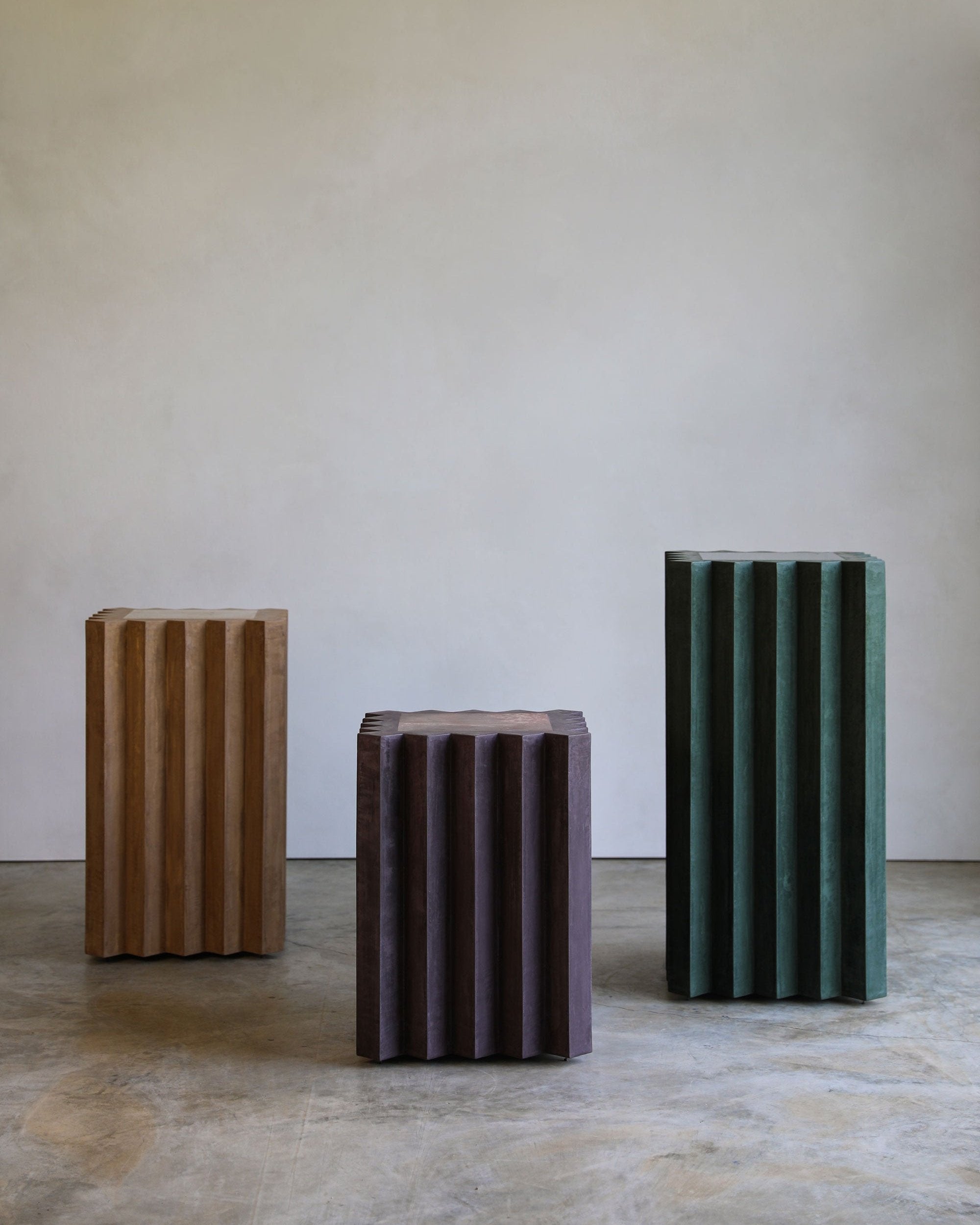 haus of hommeboys lone pedestals in green purple and tan faceted vert aubergine and buff plaster with marble insets