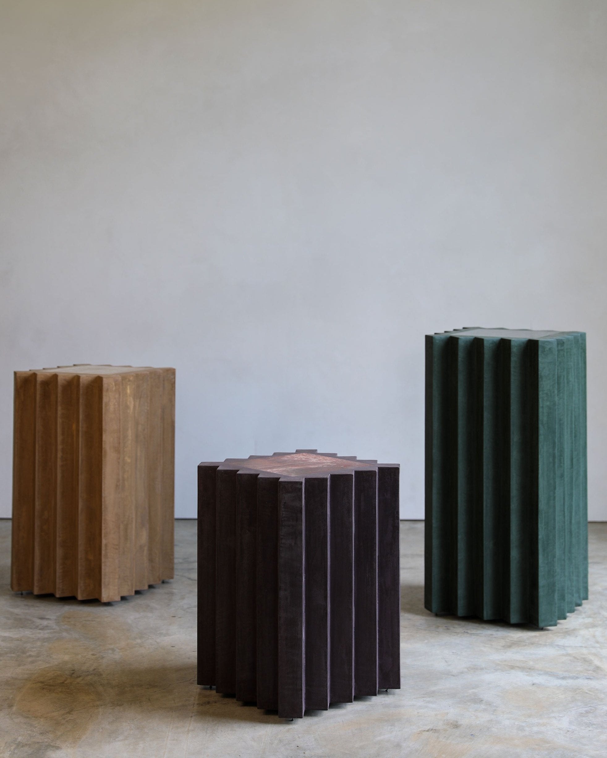 haus of hommeboys lone pedestals in green purple and tan faceted vert aubergine and buff plaster with marble insets