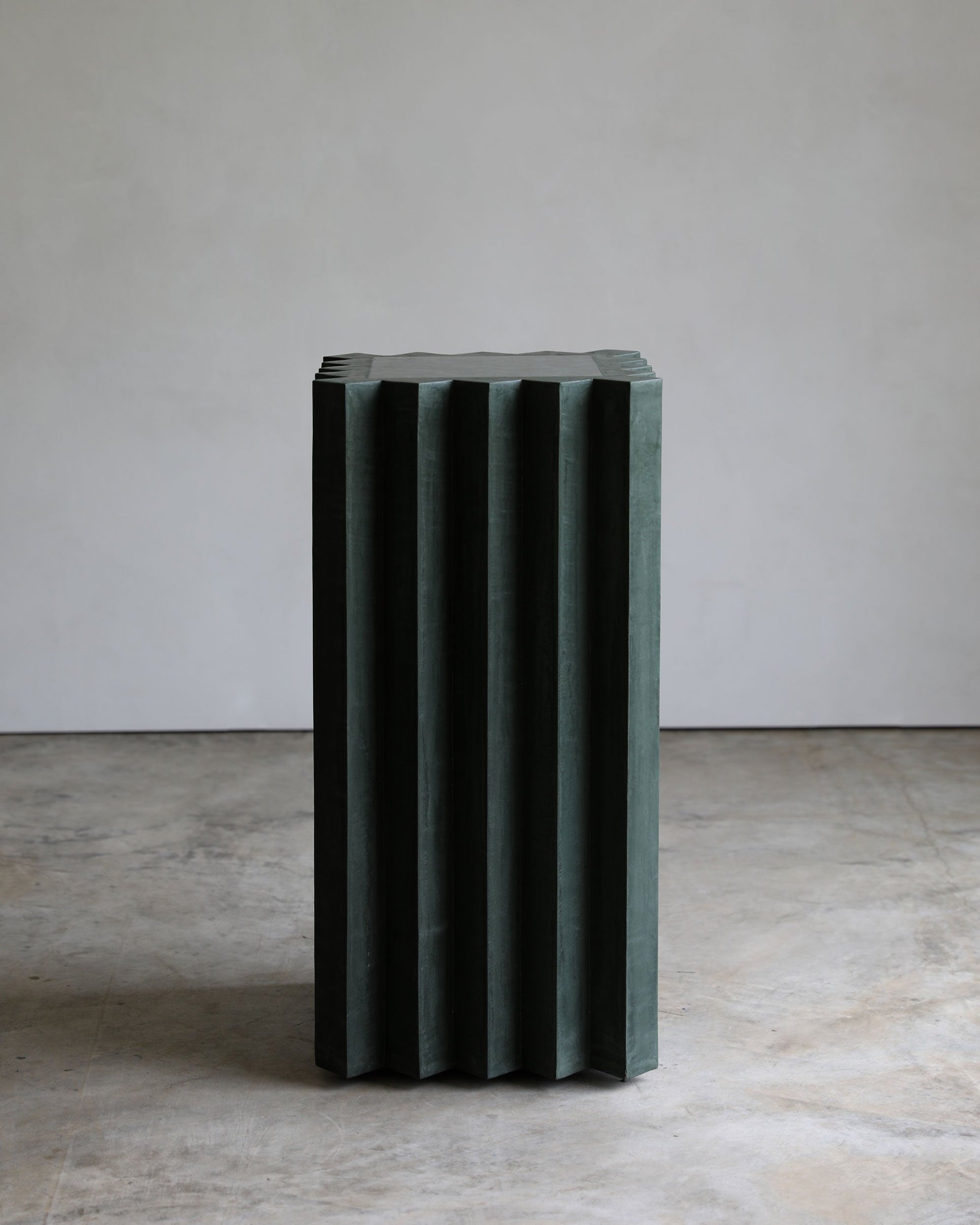 haus of hommeboys atelier lone pedestal green plaster and marble faceted