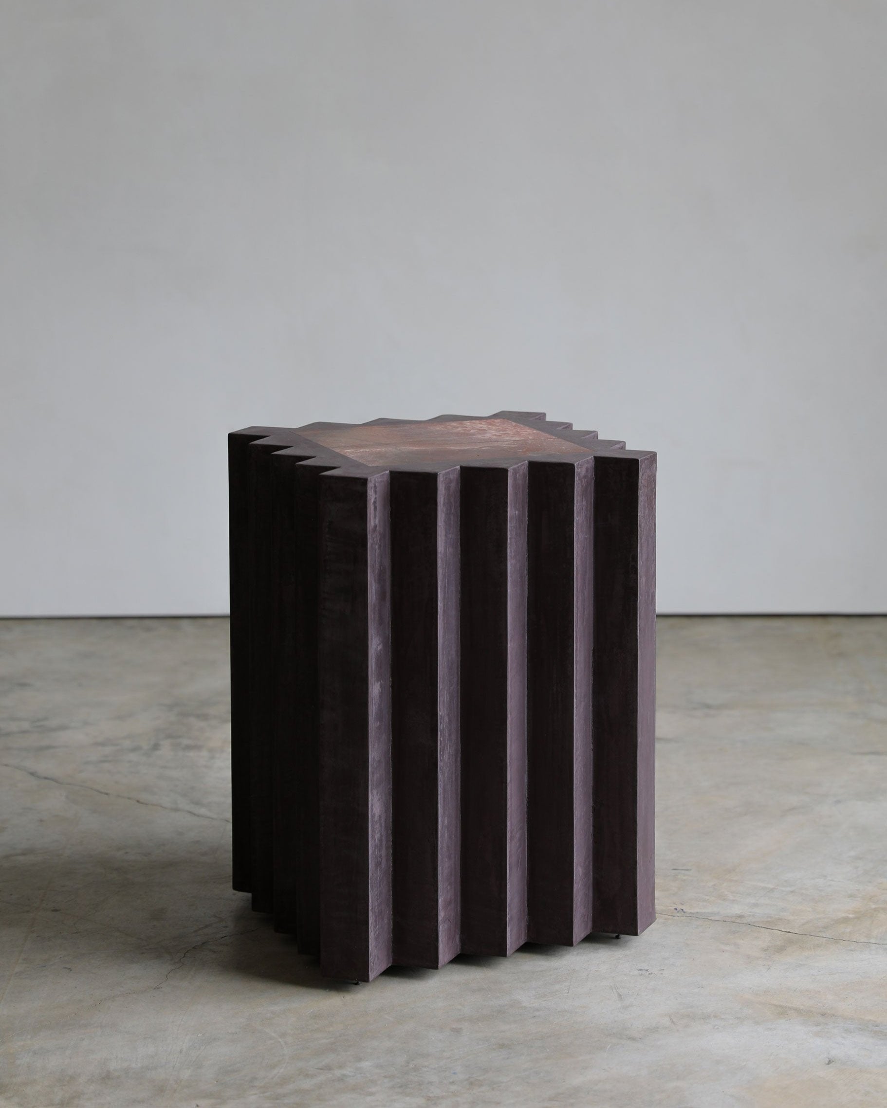 haus of hommeboys small lone pedestal in aubergine faceted purple plaster with red marble inset