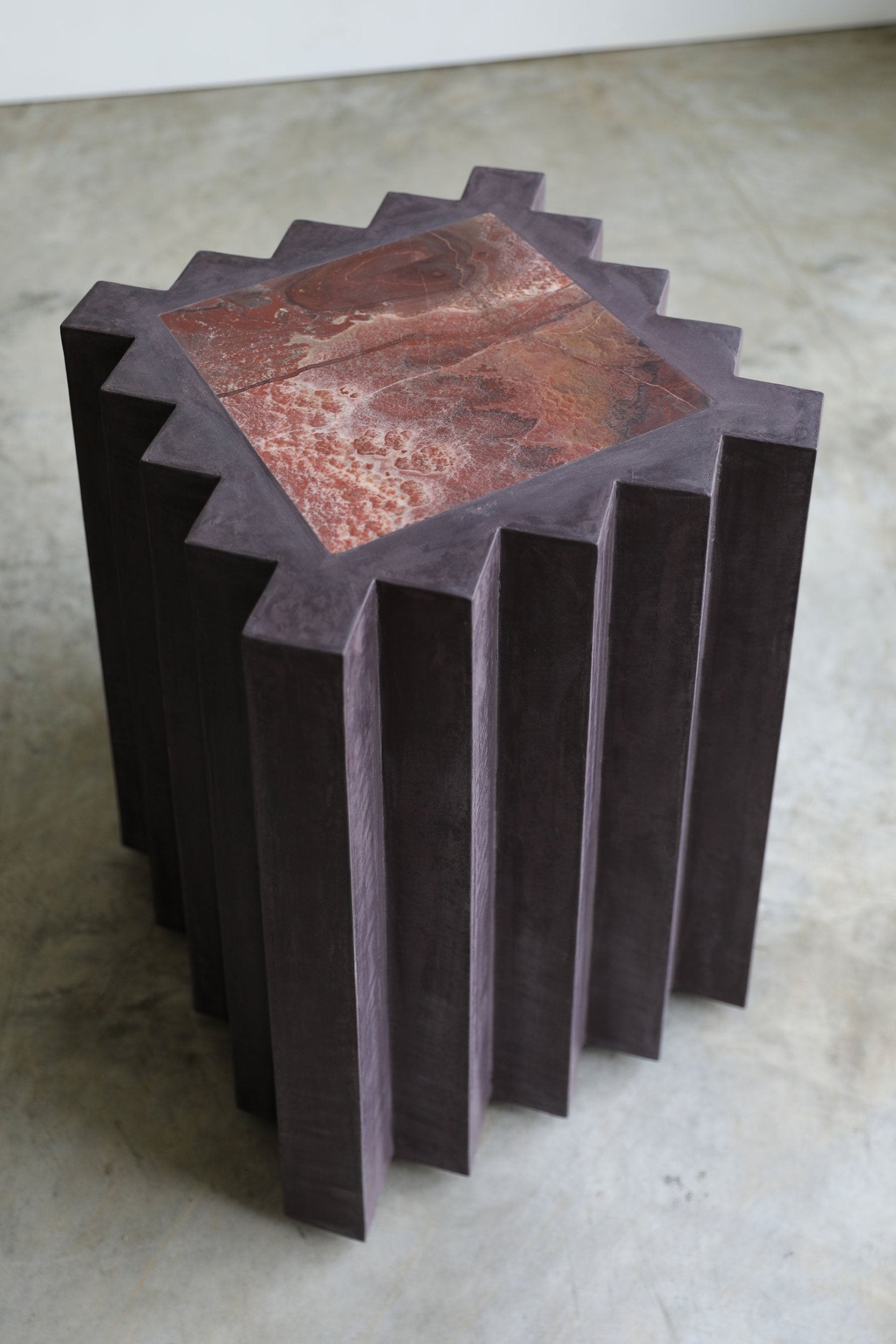 haus of hommeboys small lone pedestal in aubergine faceted purple plaster with red marble inset