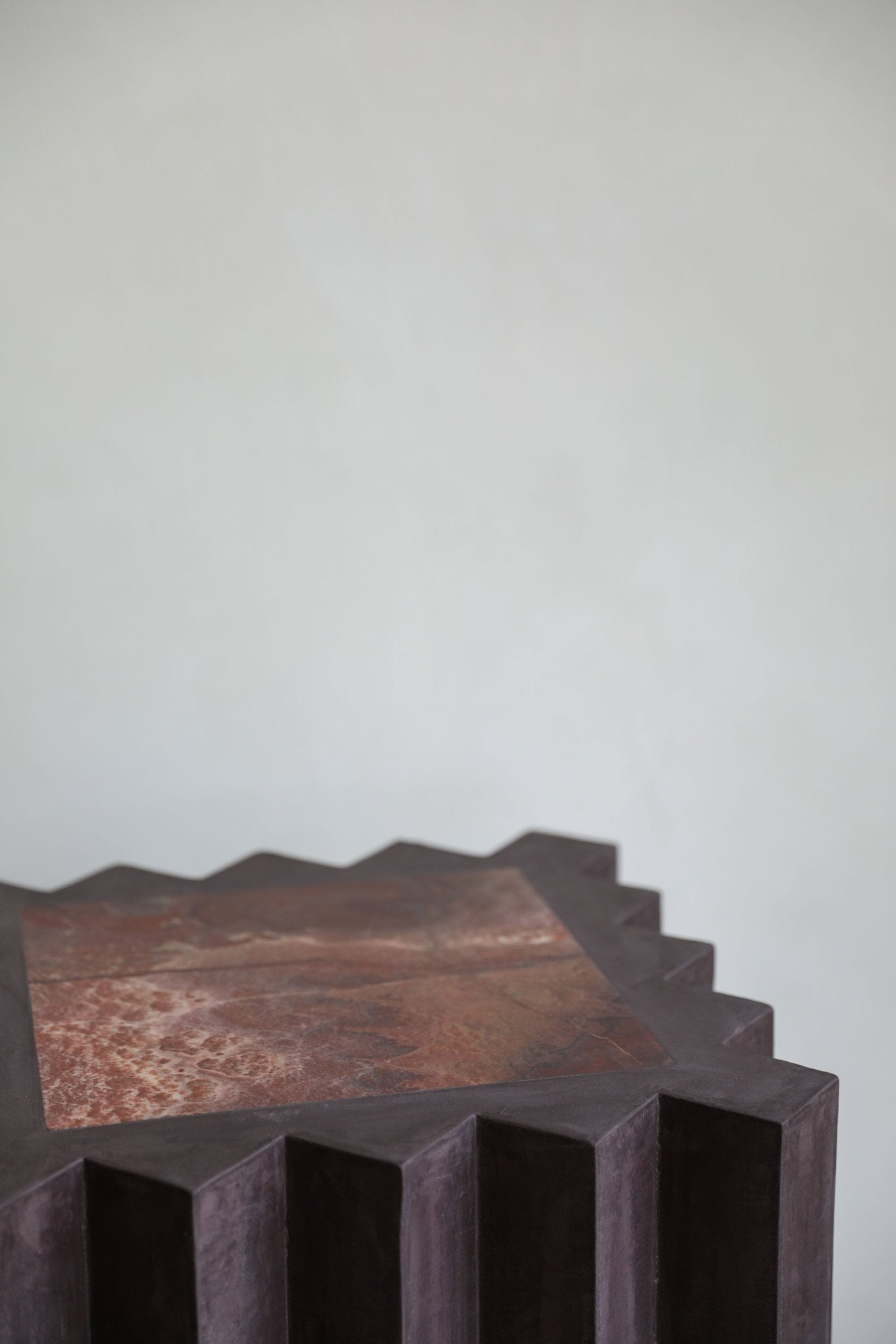 haus of hommeboys small lone pedestal in aubergine faceted purple plaster with red marble inset