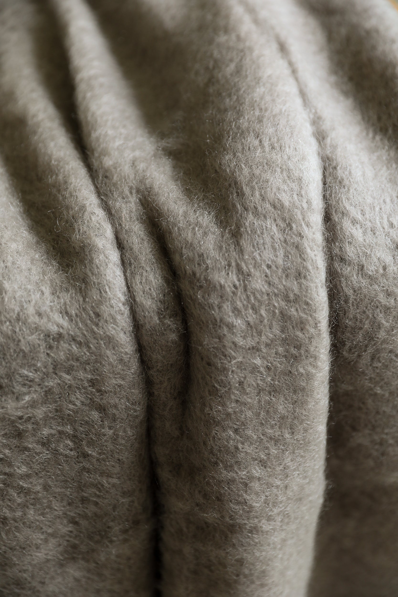 Mantas Ezcaray mushroom mohair throw blanket taupe color fabric closeup detail