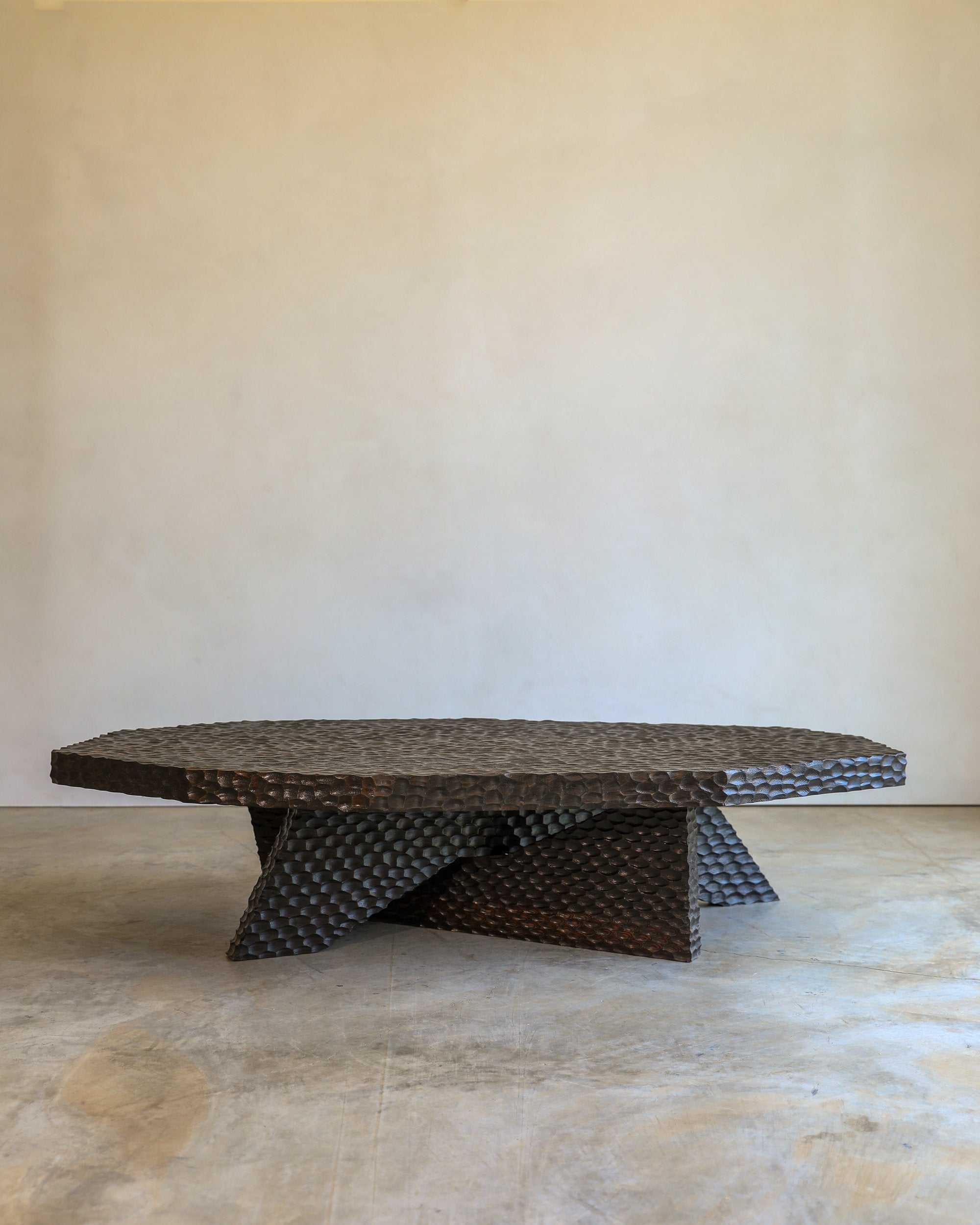 carved wood haus of hommeboys ocotillo coffee table in studio