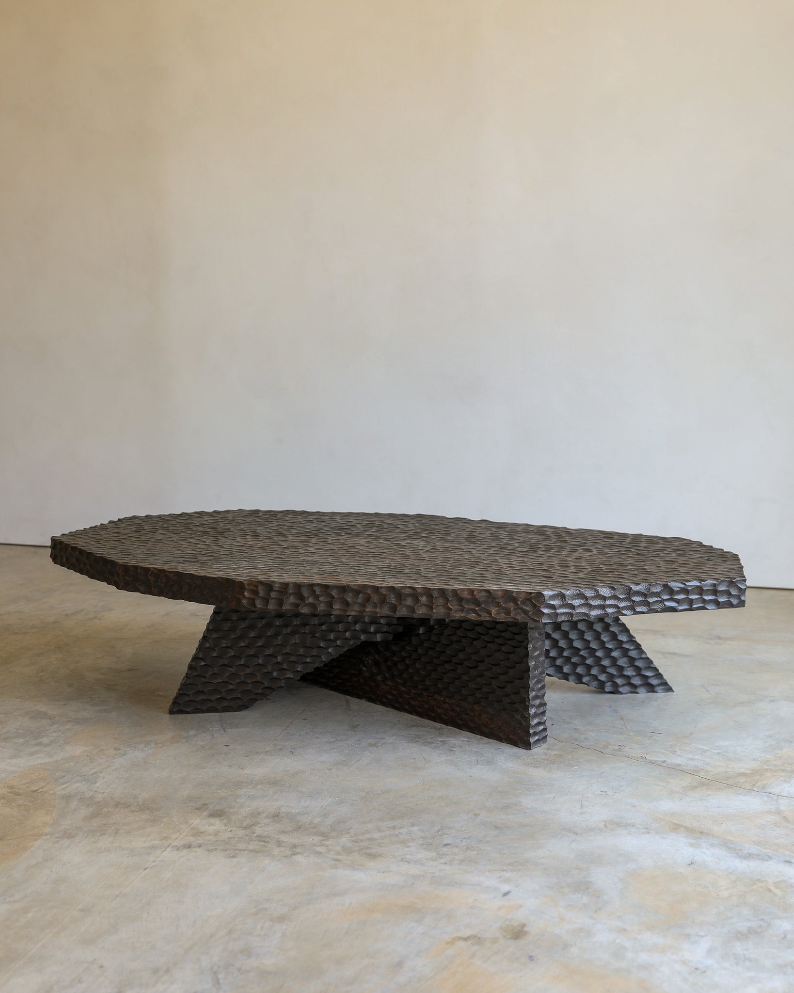 carved wood haus of hommeboys ocotillo coffee table in studio