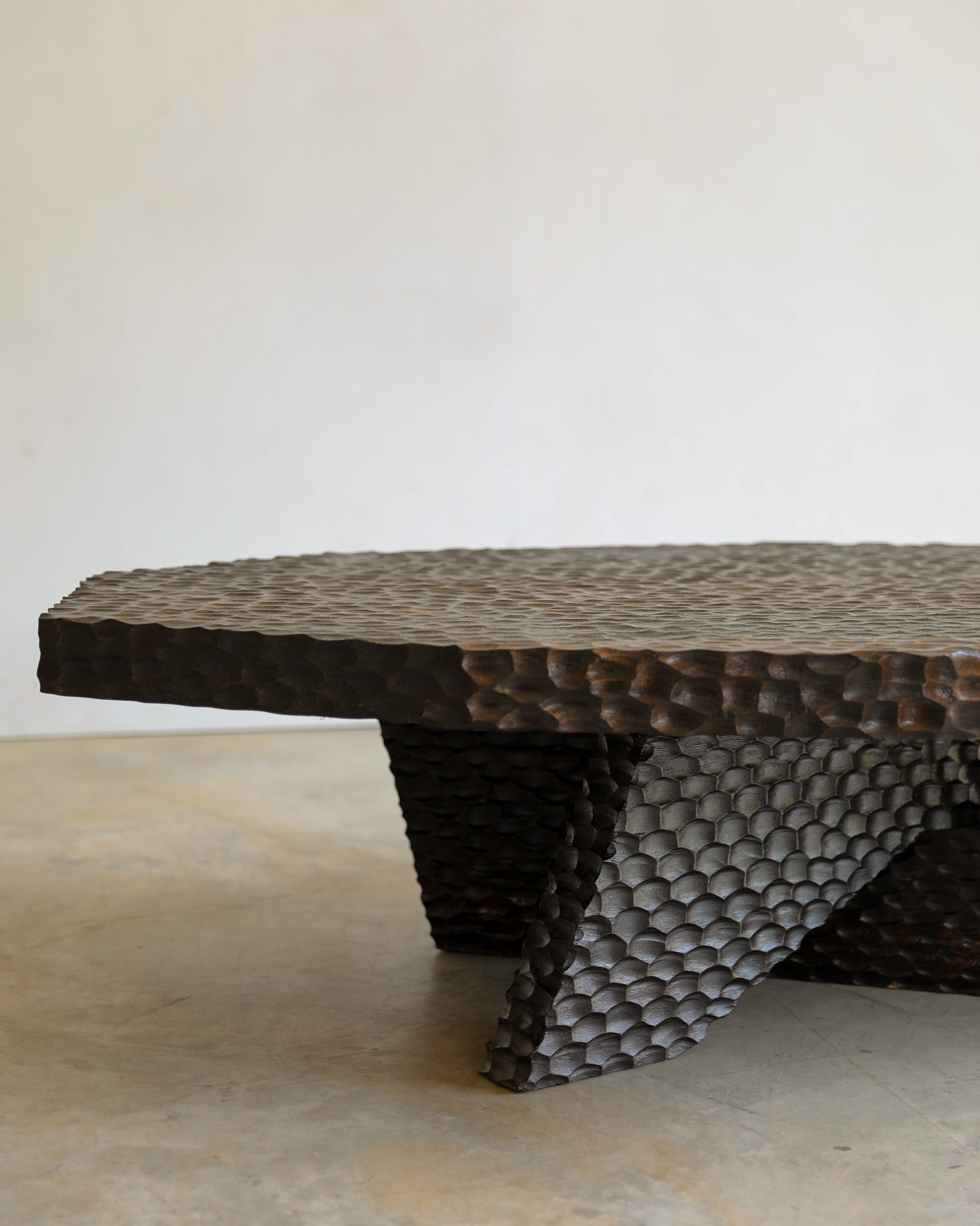 carved wood haus of hommeboys ocotillo coffee table in studio