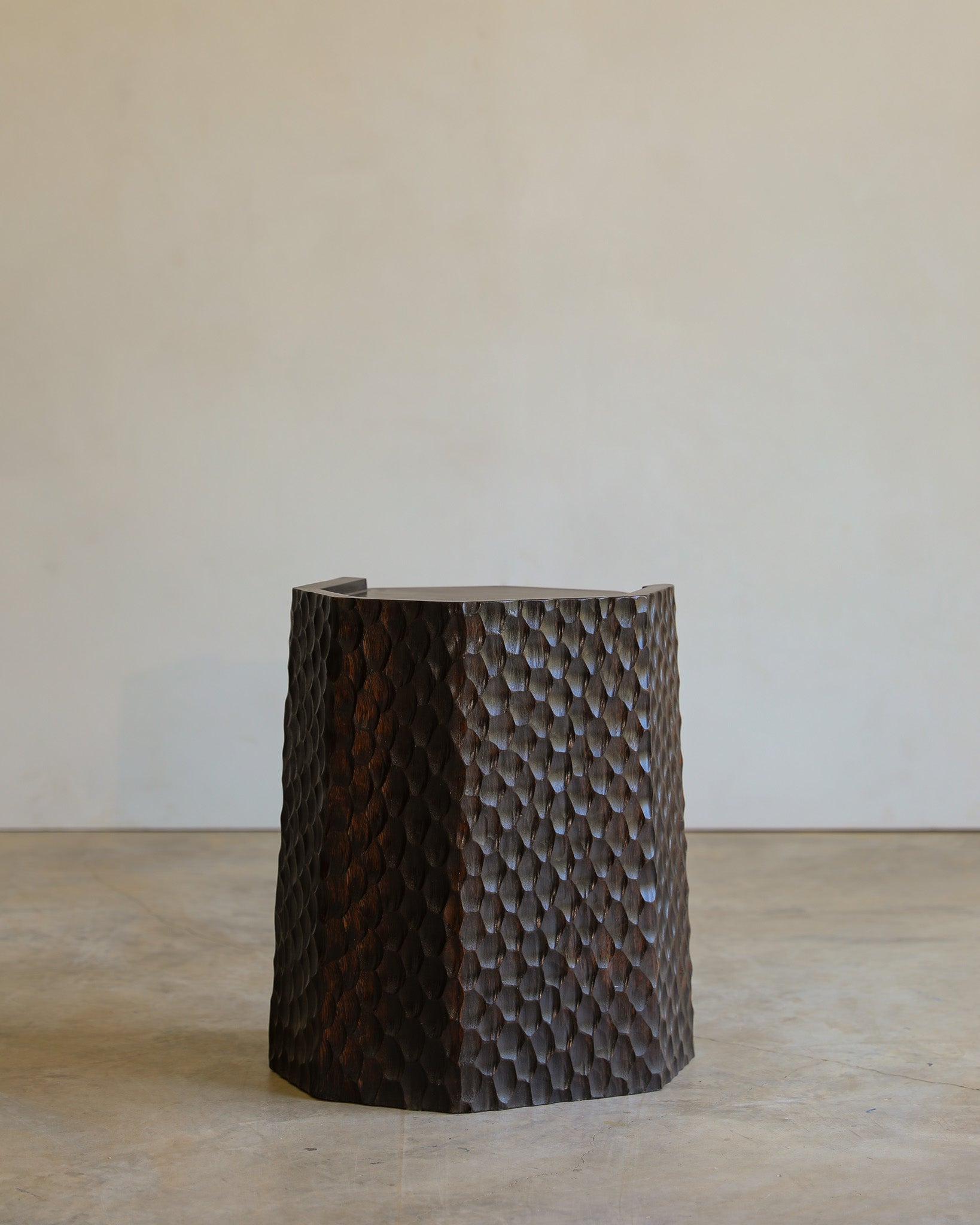 carved wood haus of hommeboys ocotillo side table in studio