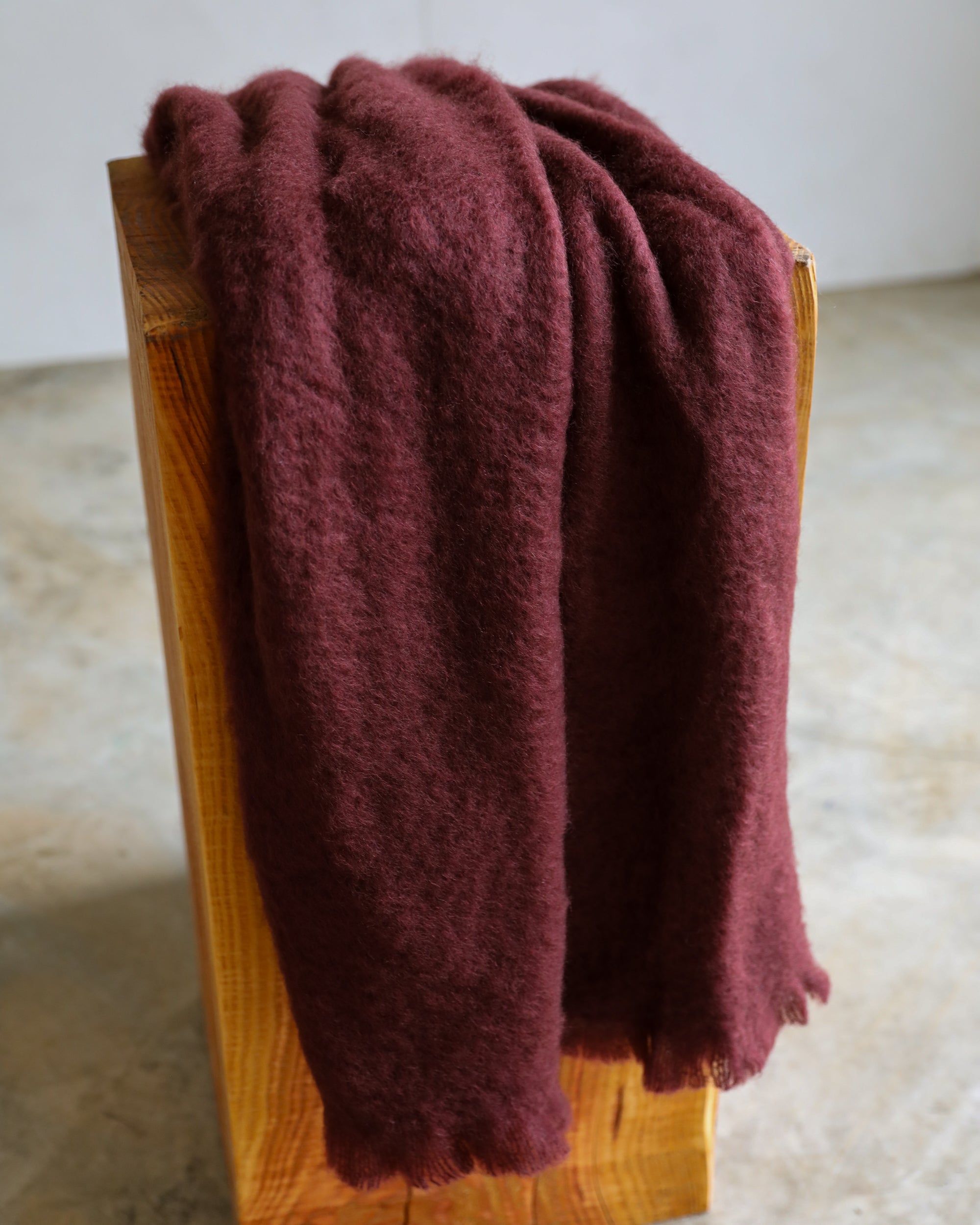 Mantas Ezcaray oxblood mohair throw blanket closeup