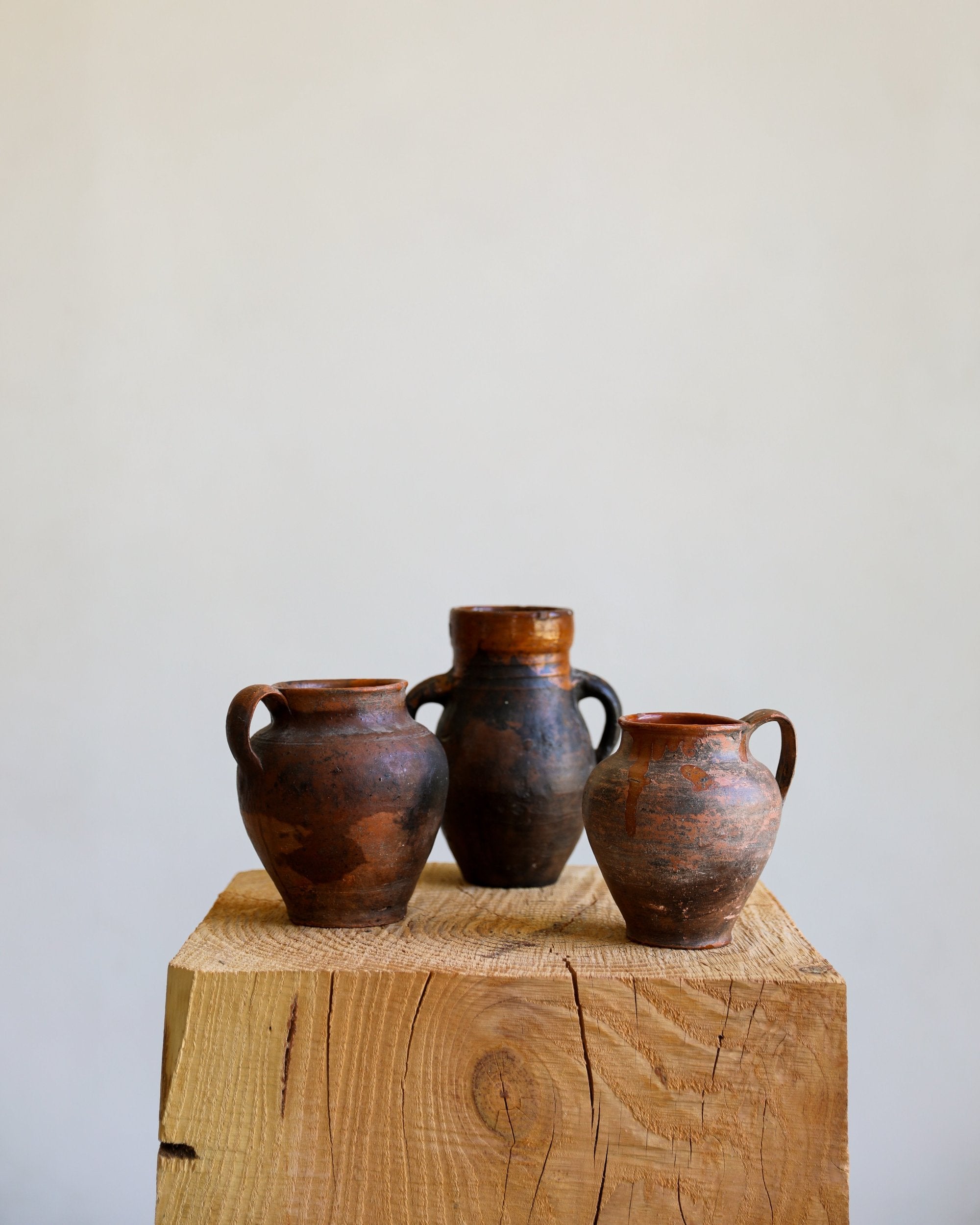 trio of vintage antique glazed terracotta pots dark brown and umber patinas