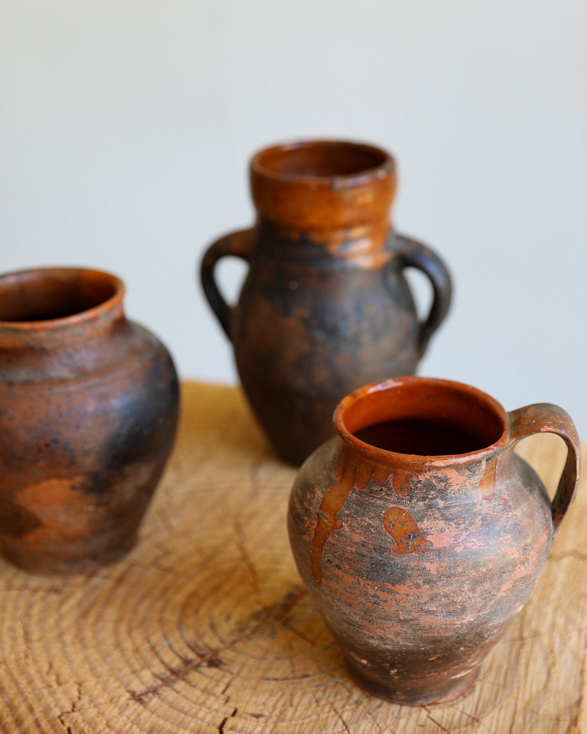 trio of vintage antique glazed terracotta pots dark brown and umber patinas