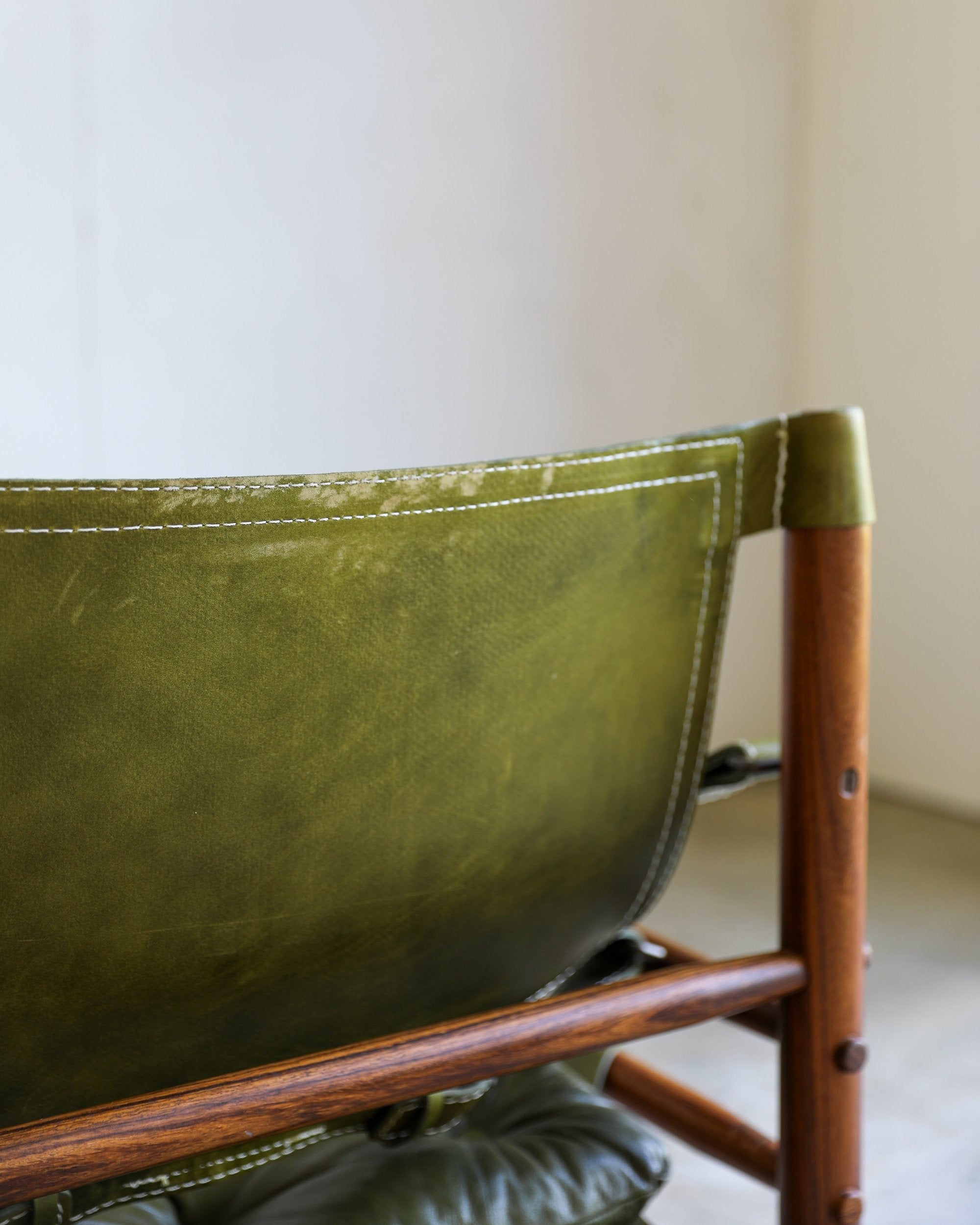 vintage swedish Arne Norell Sirocco Chair Pair in rosewood and original green leather upholstery back wear closeup