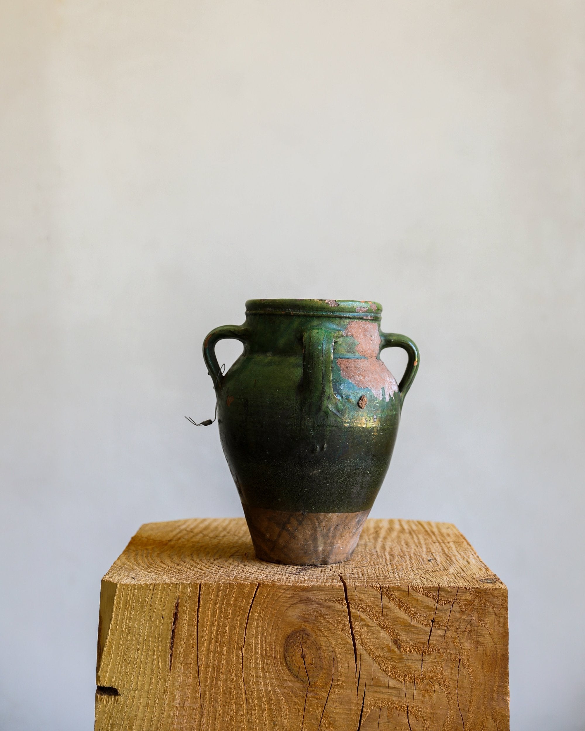 three handled vintage antique glazed green terracotta pot with chipping and  patina